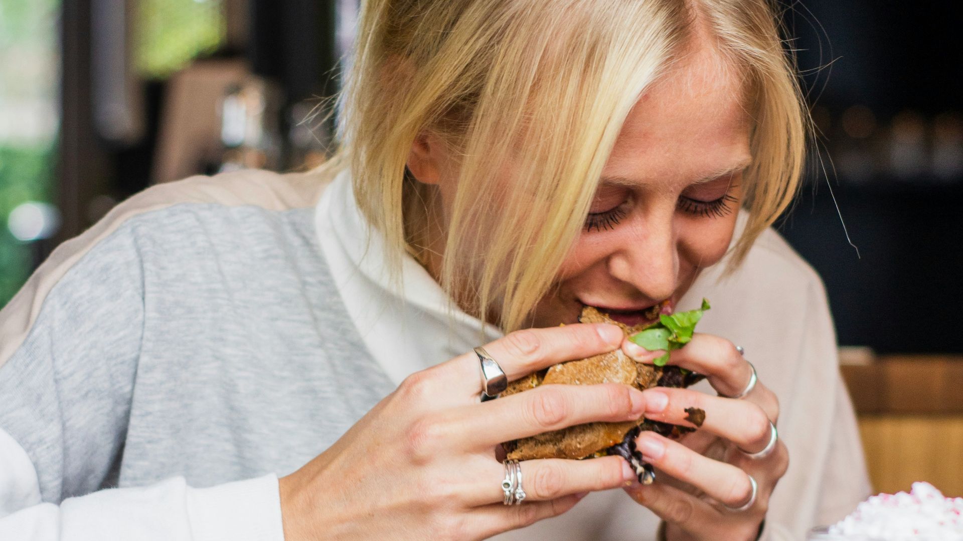 woman eating burger