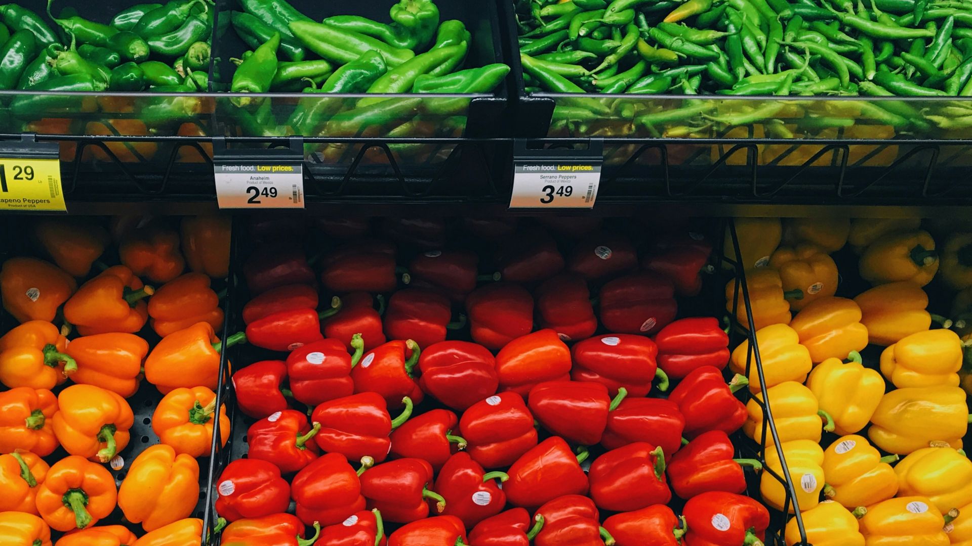 pile of bell peppers and beans at the grocery