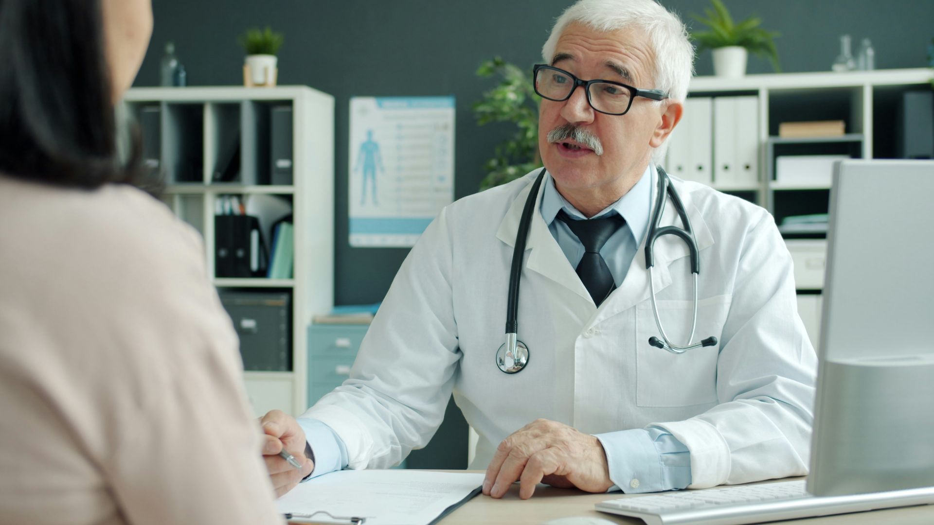 Doctor talking to patient in an office
