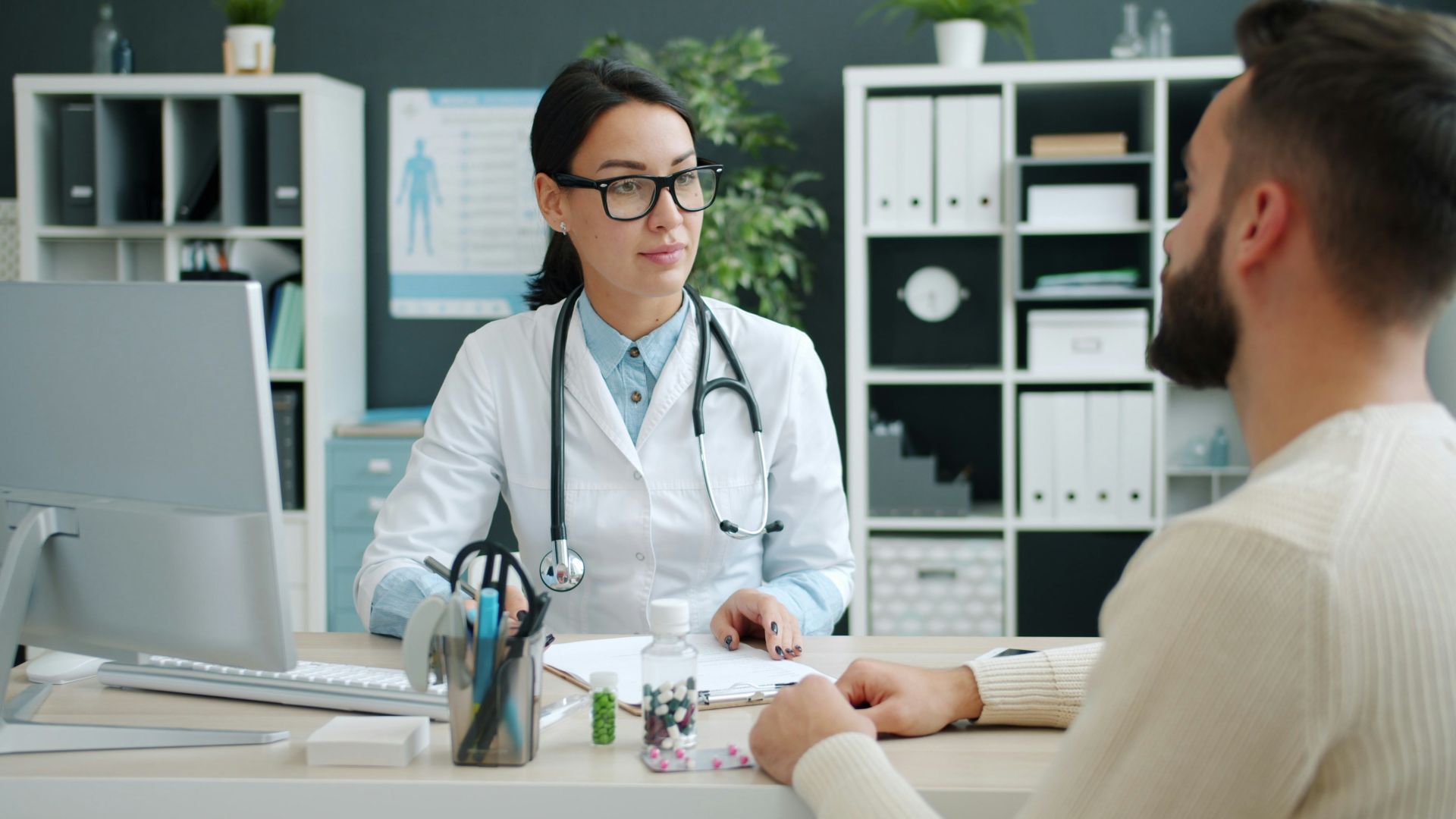 Doctor consults with patient in medical office