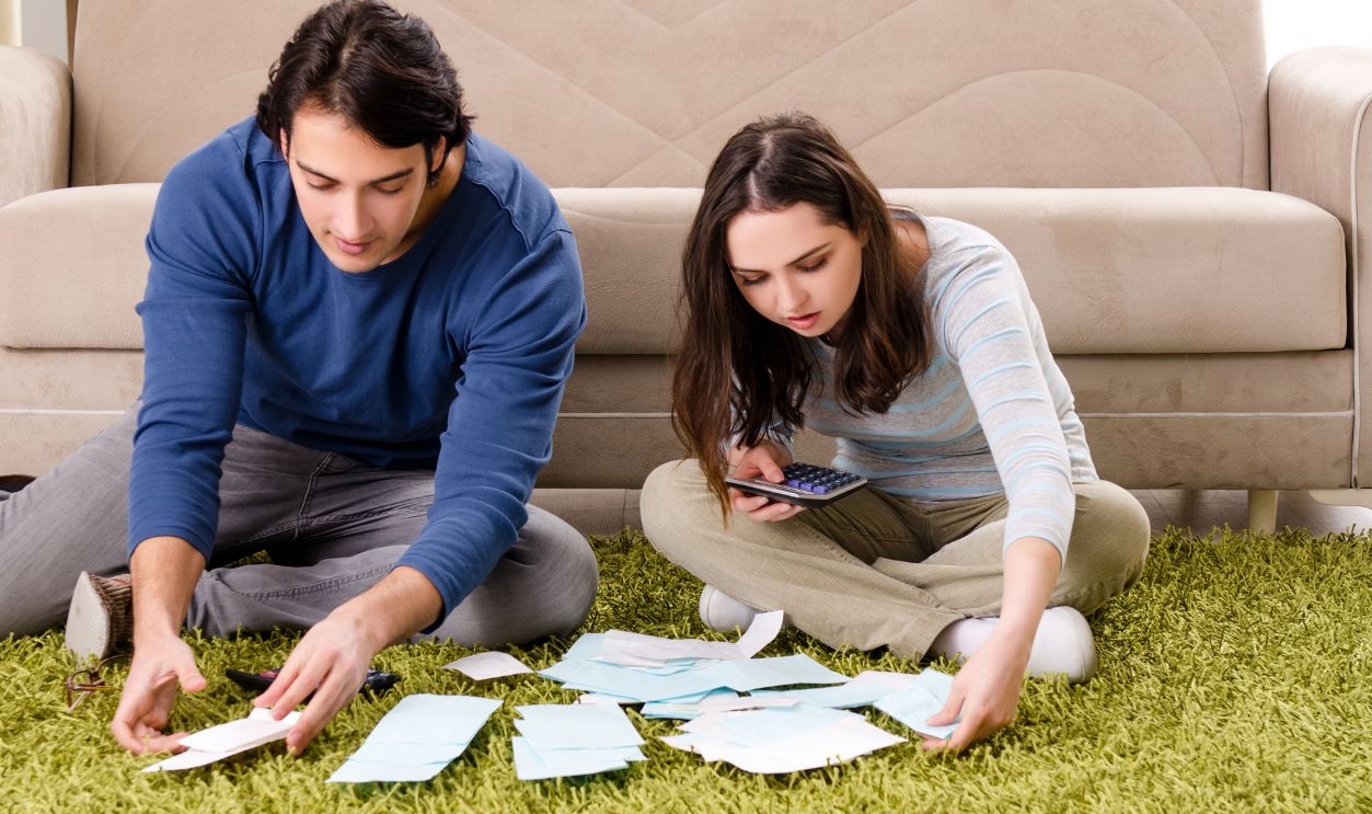 Young couple in budget planning concept
