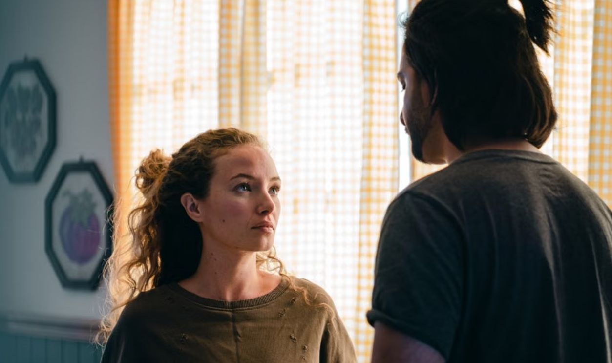 A thoughtful couple discussing important matters in their living room, creating a pensive atmosphere