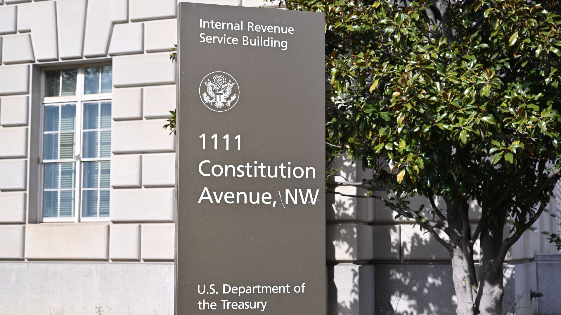 Close-up of a sign at 1111 Constitution Avenue NW, Washington, DC 20004. The sign says the occupying agencies are the U.S. Department of Treasury and the Internal Revenue Service.