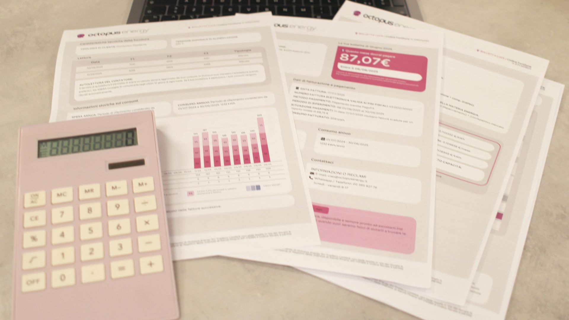 Bills, calculator, and a laptop: financial tasks underway