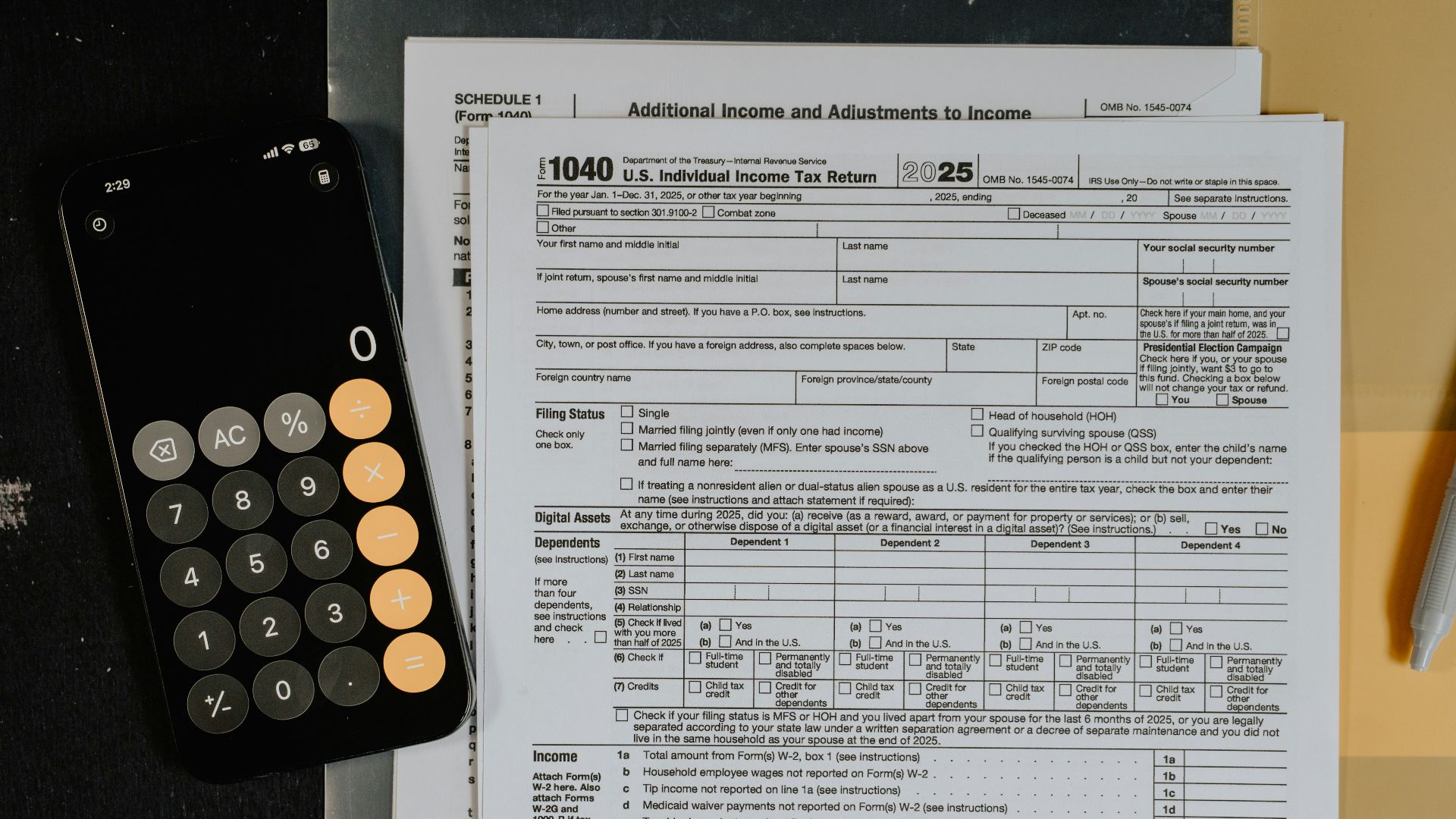 Tax forms and calculator on a desk