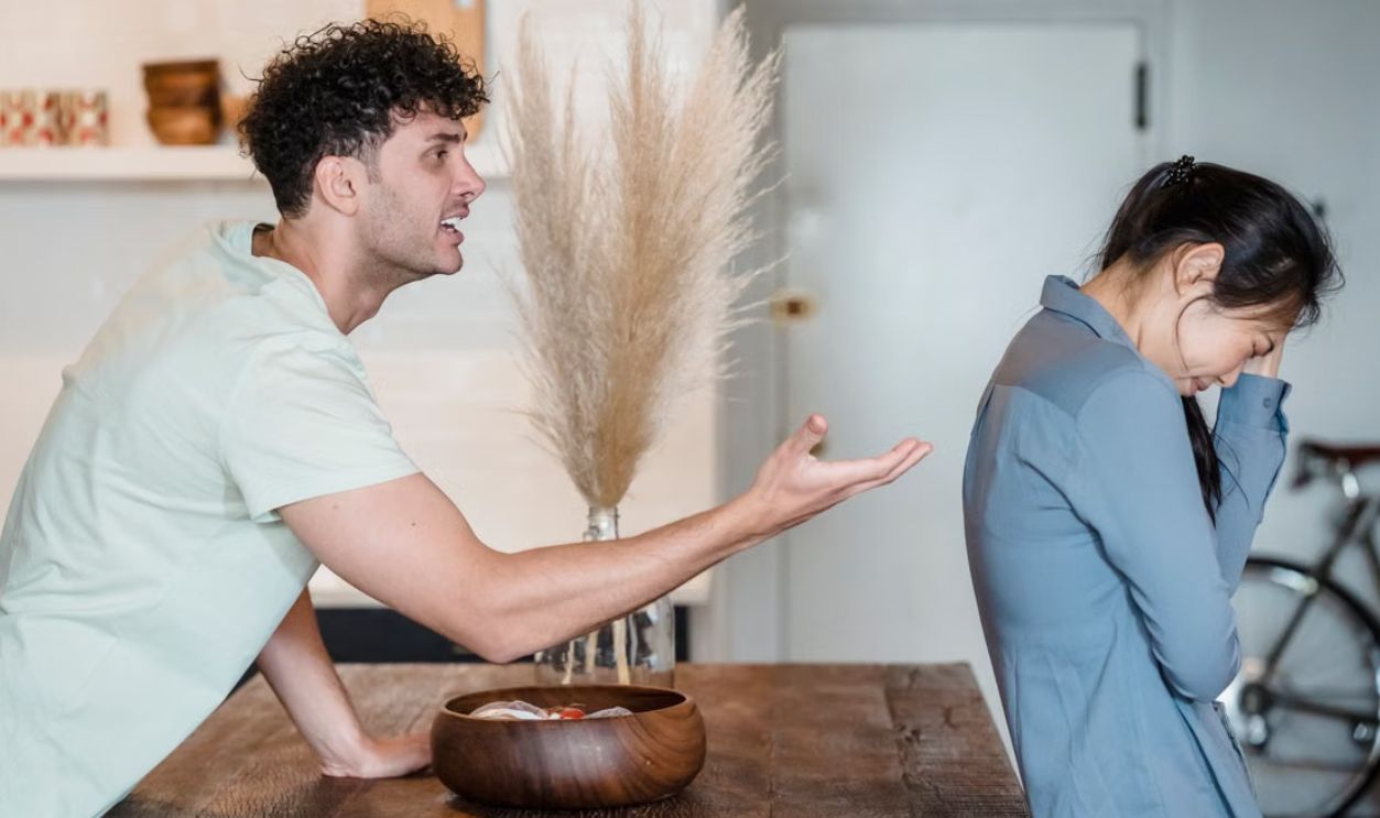 An intense argument between a couple indoors, depicting emotional distress and communication issues