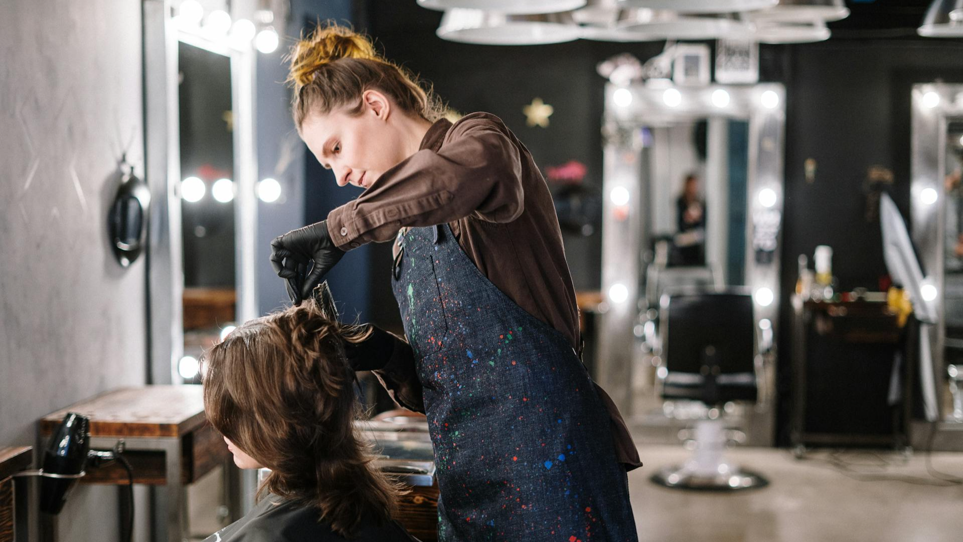 Woman Getting a Haircut in a Salon