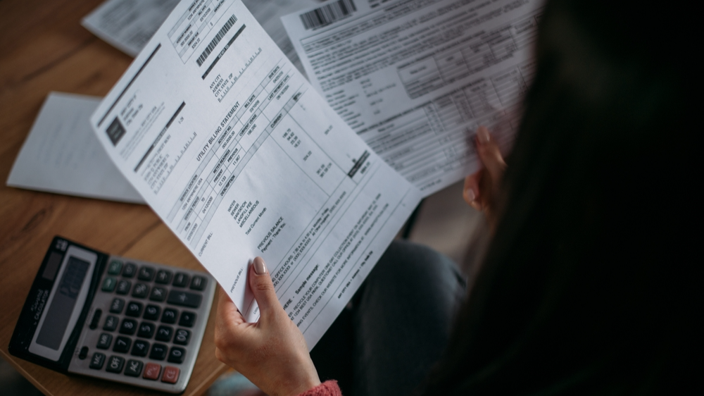 Woman looking at utility bills