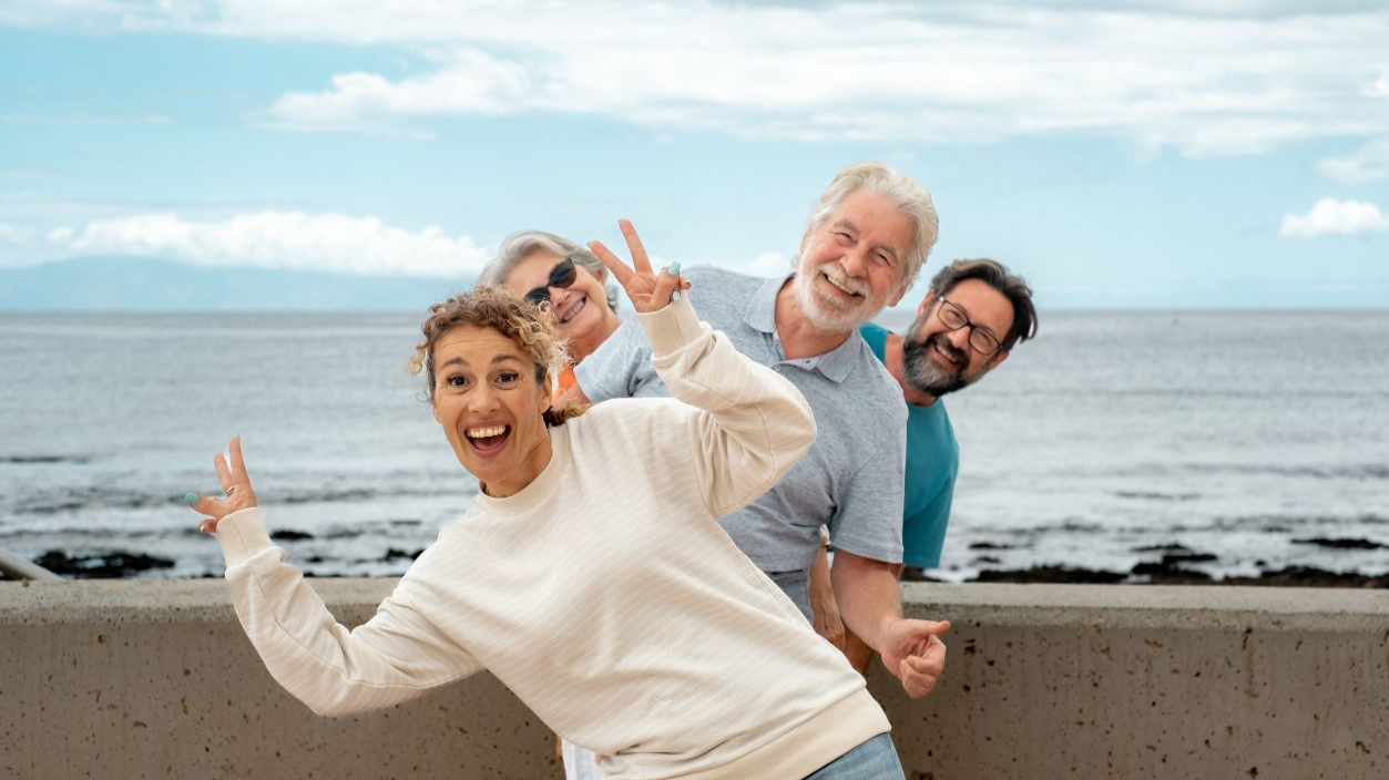 Shutterstock-2320704477, Happy Multi generation family in sea vacation have fun together in outdoor smiling carefree. Old parents, mature son and daughter-in-law