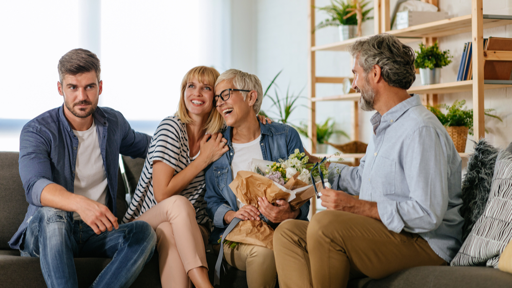 Shocked man in blue shirt meeting his girlfriend's parents