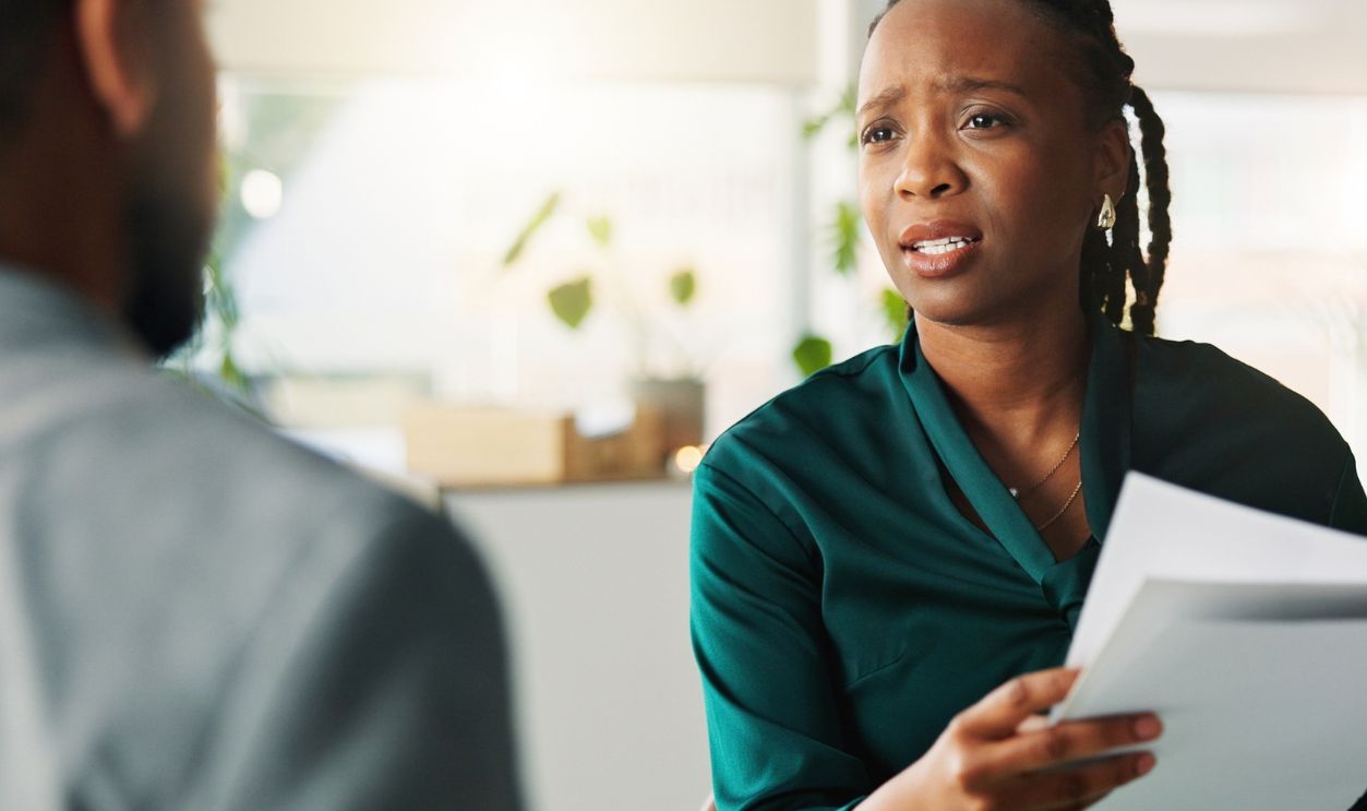 Shutterstock-2730066147, Financial advisor, documents and woman with consultation, talking and application for loan. People, employee and client in office, discussion and appointment for investment opportunity and contract