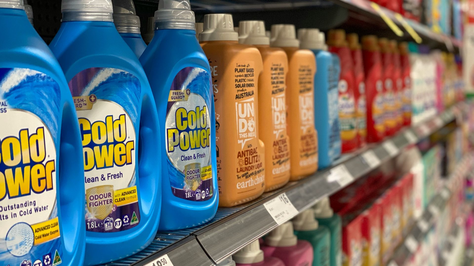 bottles of cold power on a shelf in a store