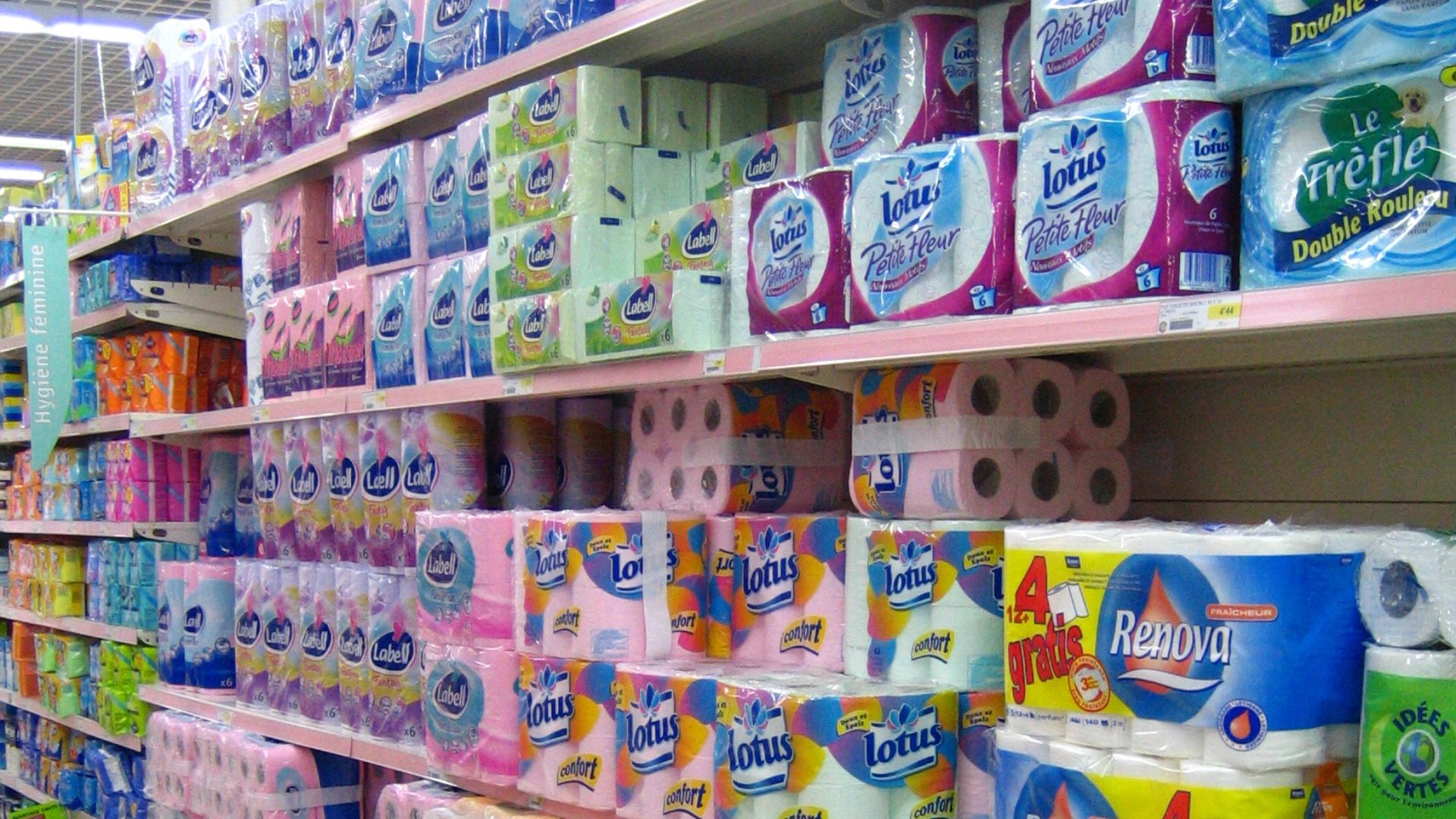 Toilet paper rolls on a supermarket shelf