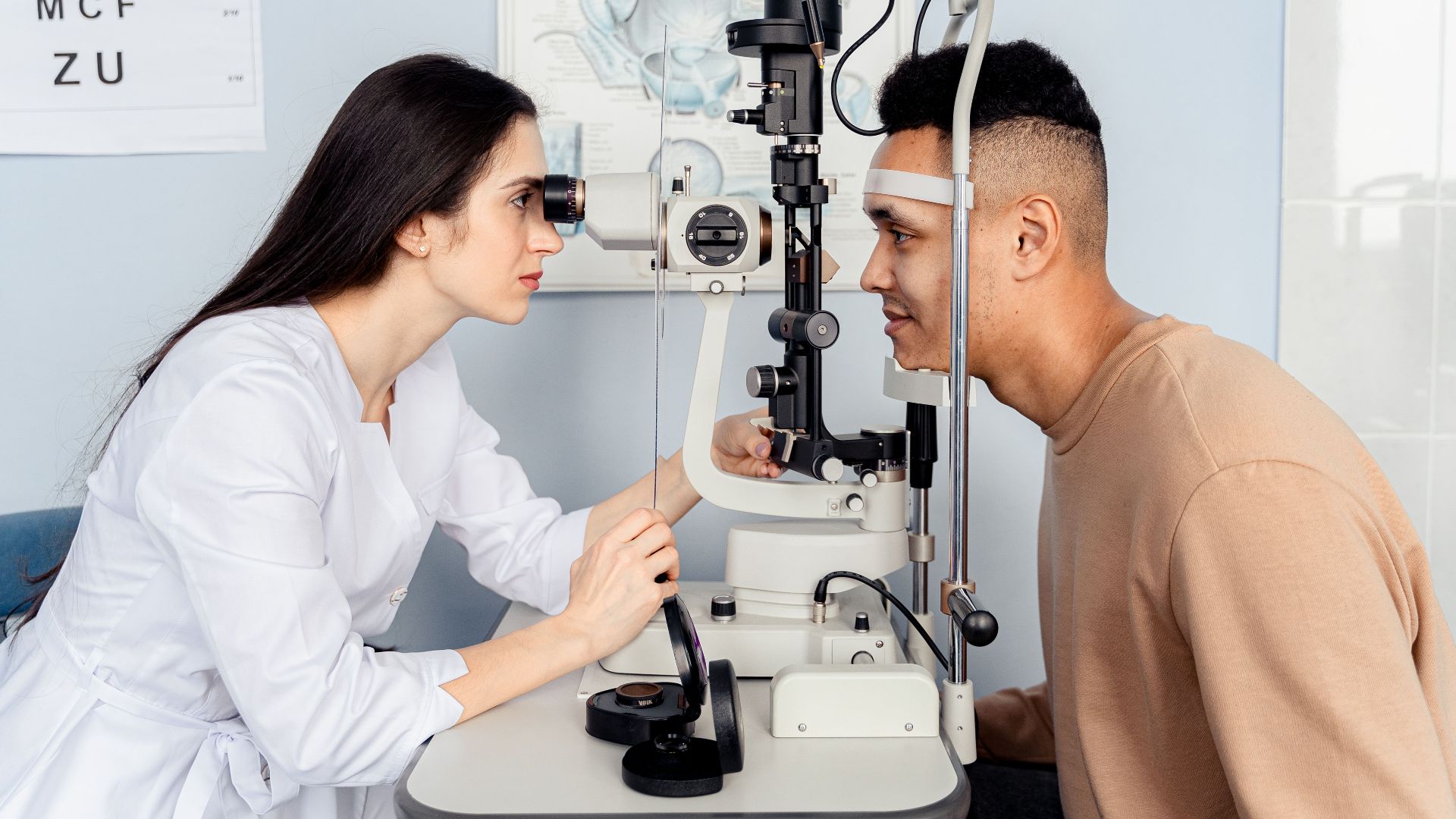 Professional eye examination conducted by an optometrist using modern equipment with a patient.