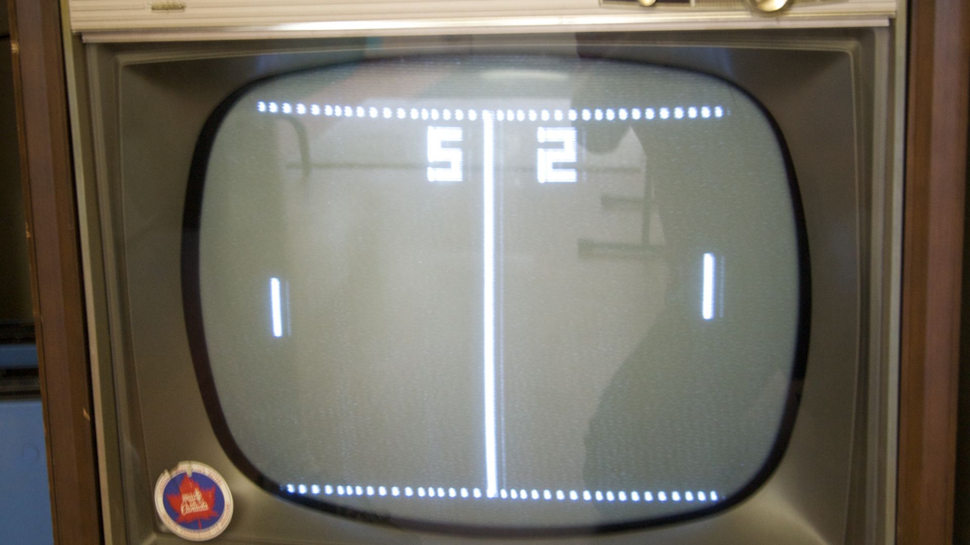 Game of Pong playing on a TV set. The image came from a Magnavox Odyssey 3000, visible on the top of the original un-cropped image