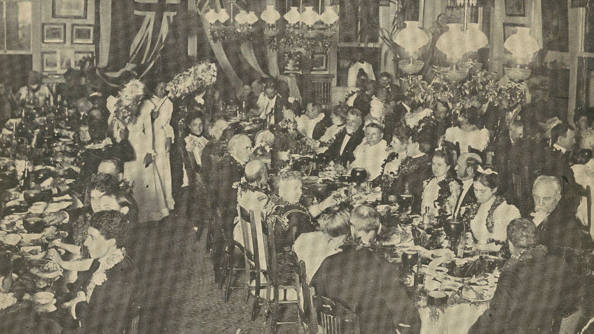 The luau or banquet at ʻĀinahau for the U.S. Annexation Commissioners, hosted by Princess Kaiulani who is looking towards camera on the left side of the photo. Published in the Leslie's Weekly October 20, 1898, P. 308.