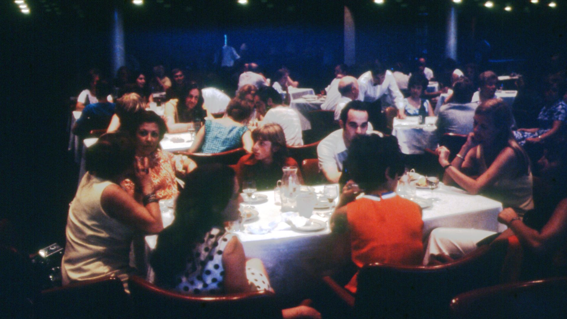 The image is unidentified, but it features a scene of a restaurant. The photo was taken in 1975 in Leningrad, Russia.