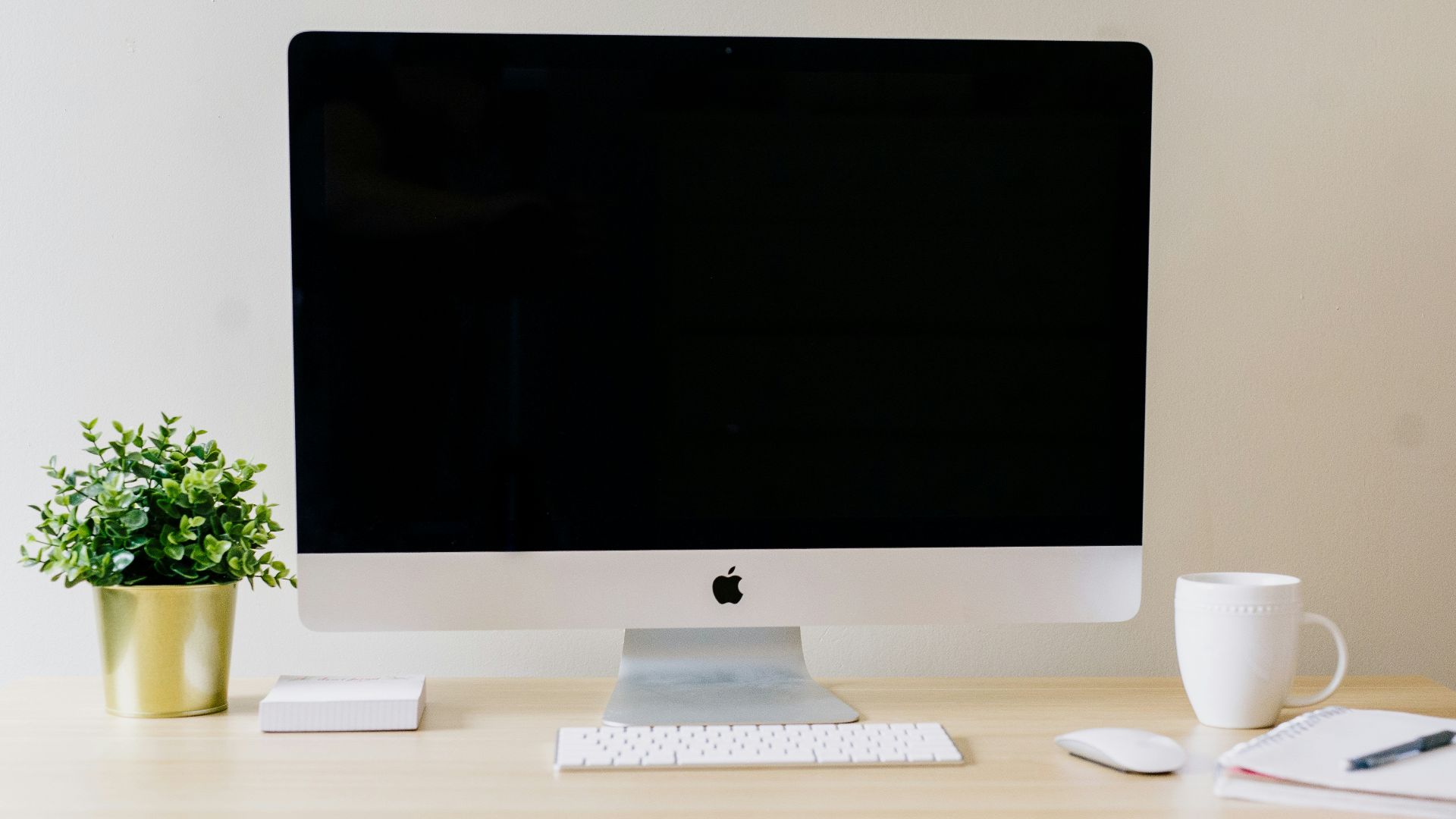 silver iMac, Apple Magic Keyboard, and Apple Magic Mouse