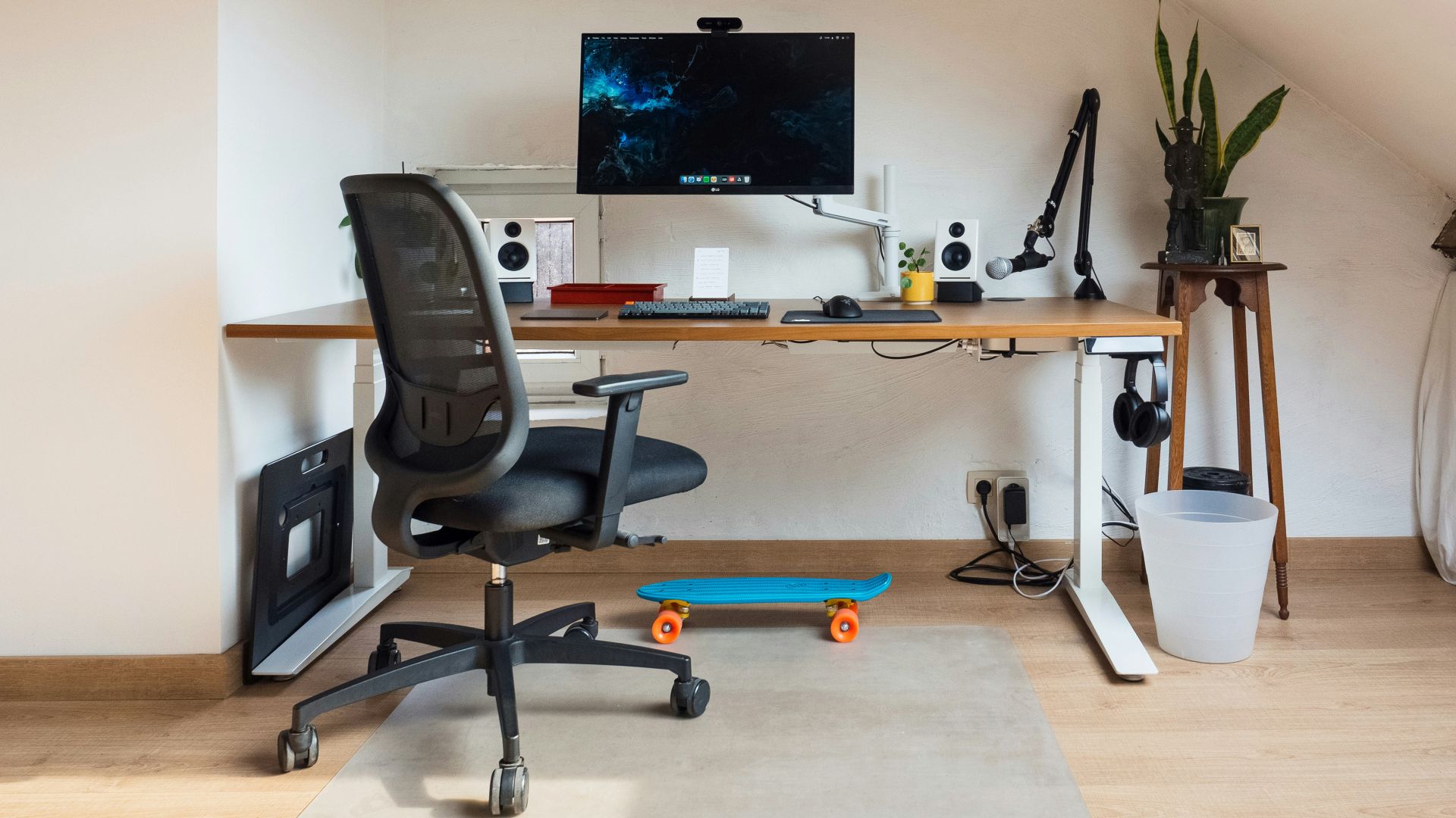 a desk with a computer on top of it