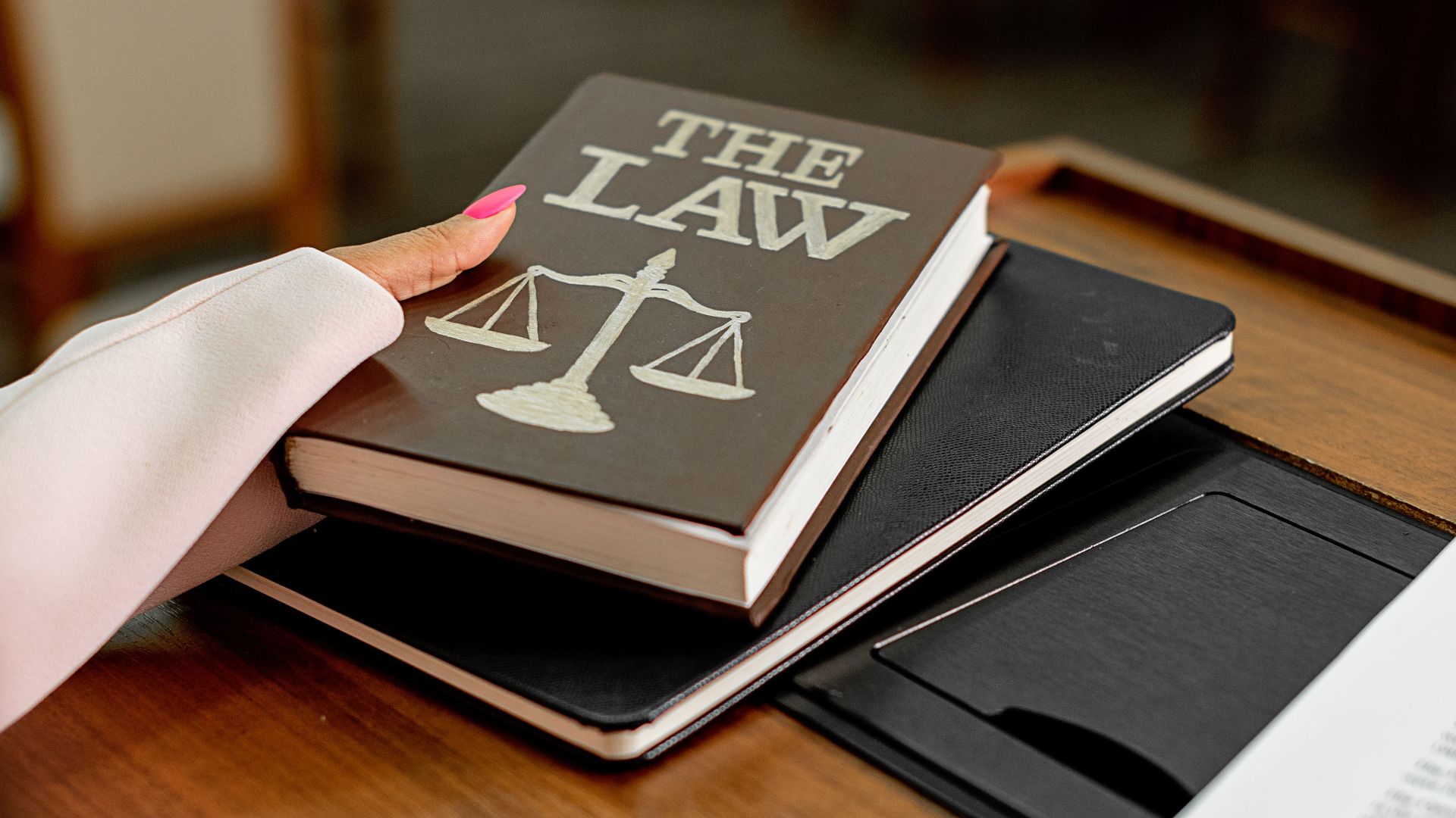 Close-up of a law book on a podium in a conference setting, symbolizing legal knowledge.