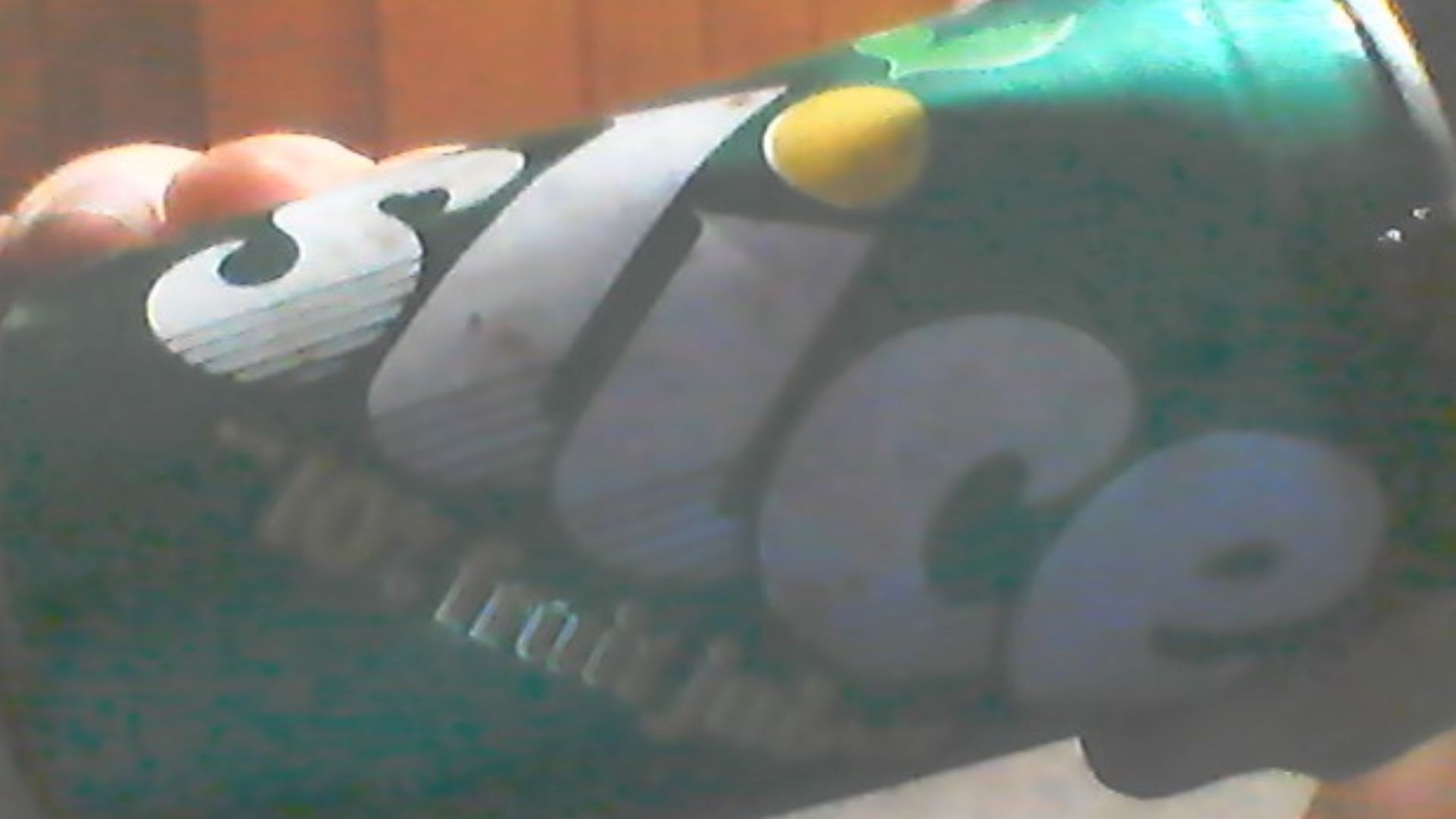A Picture of a can of splice that i found in the ground of my yard. I took the picture with my laptop webcam in my room.