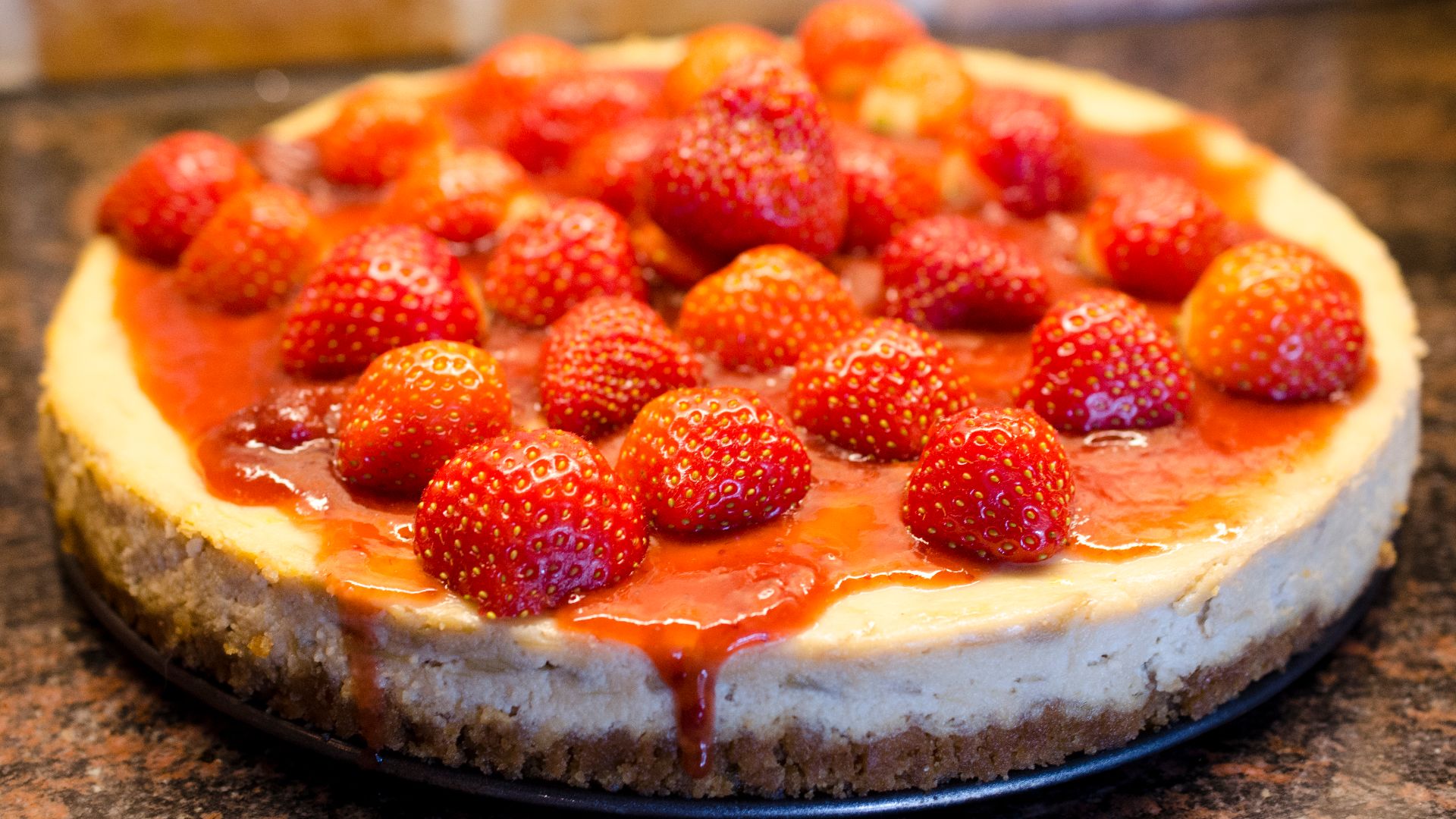 A whole strawberry cheesecake