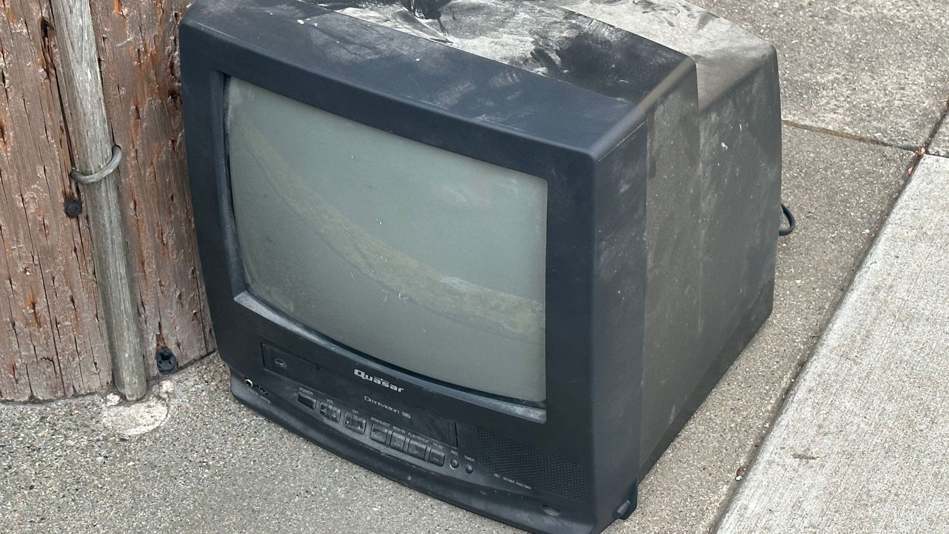 Quasar VV-1303A television set seen discarded in front of Presidio Middle School in San Francisco, California (out of frame)