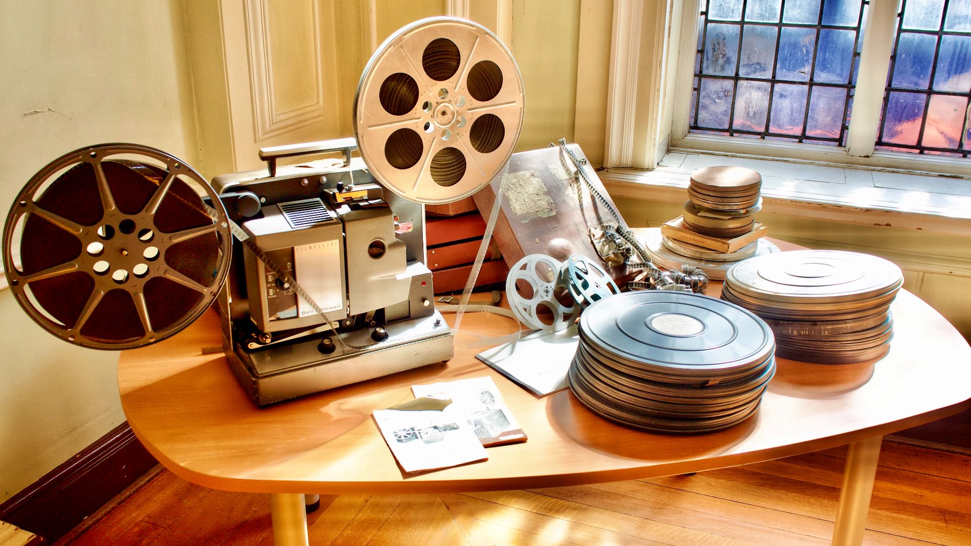A Bell & Howell film projector and film canisters in the Recreation Hall at the Retreat Hospital, York