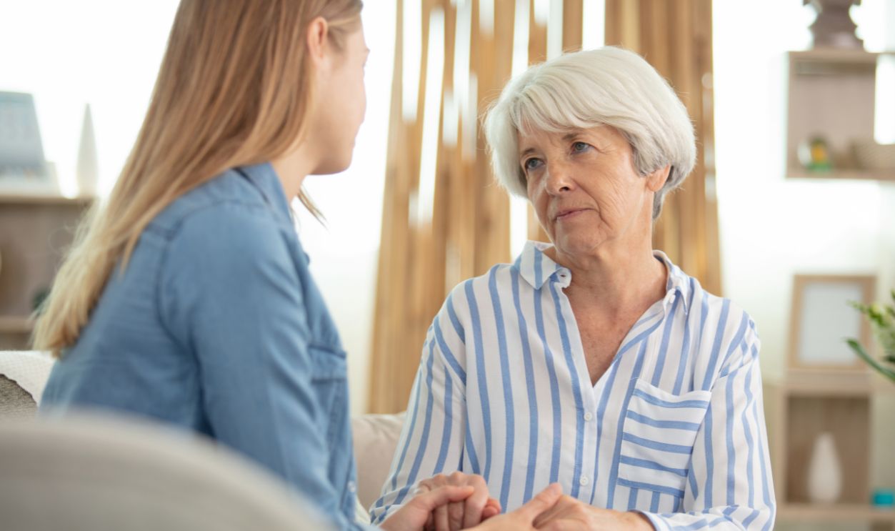 senior mum talking to her daughter