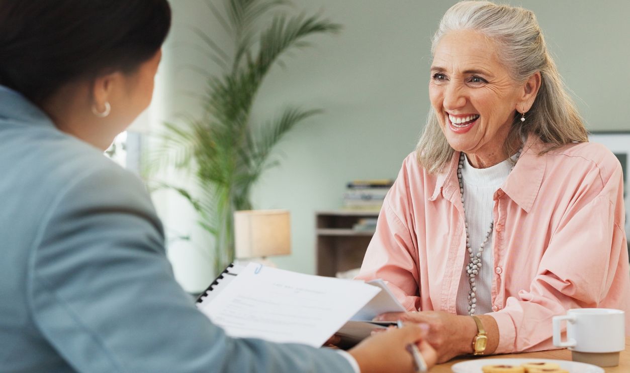 Shutterstock-2678864675, Senior woman, lawyer and documents with contract for testament, legal advice or last will in home. Elderly, female person or attorney with paperwork for consultation, policy or agreement in house