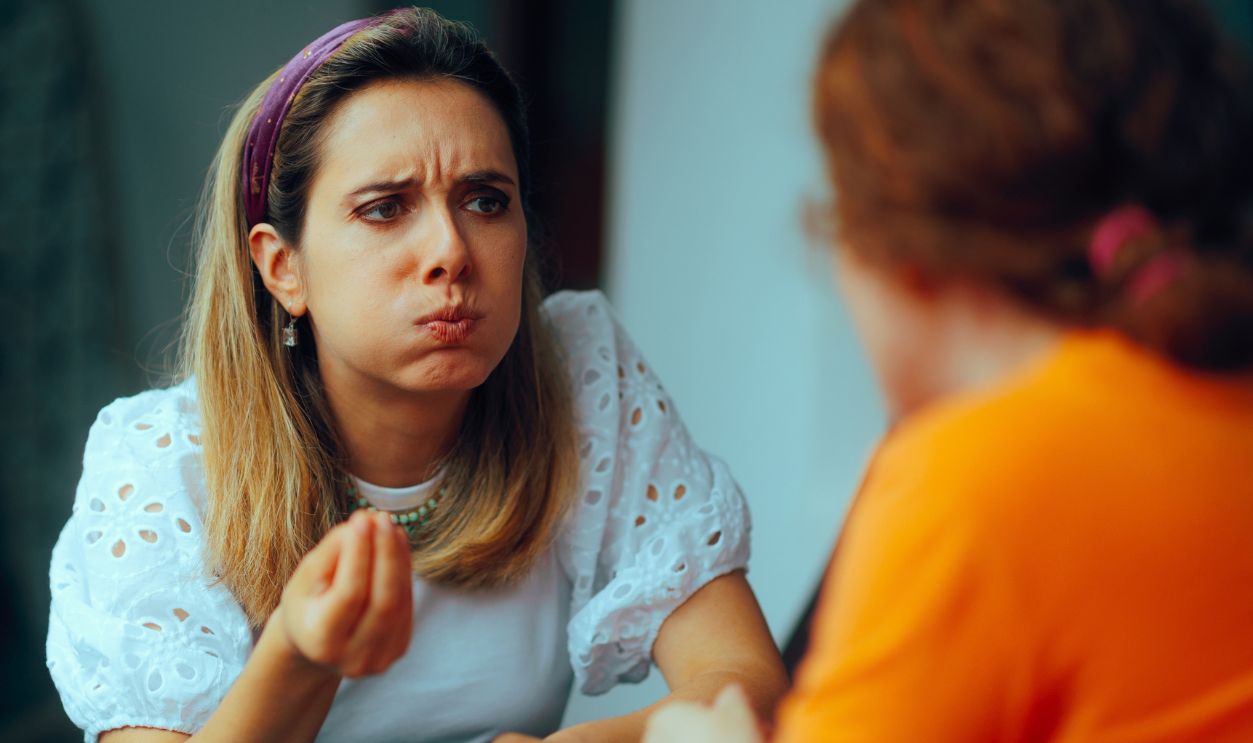 Women Having a Fight Sitting at Home Discussing. Friends arguing over something important feeling displeased 