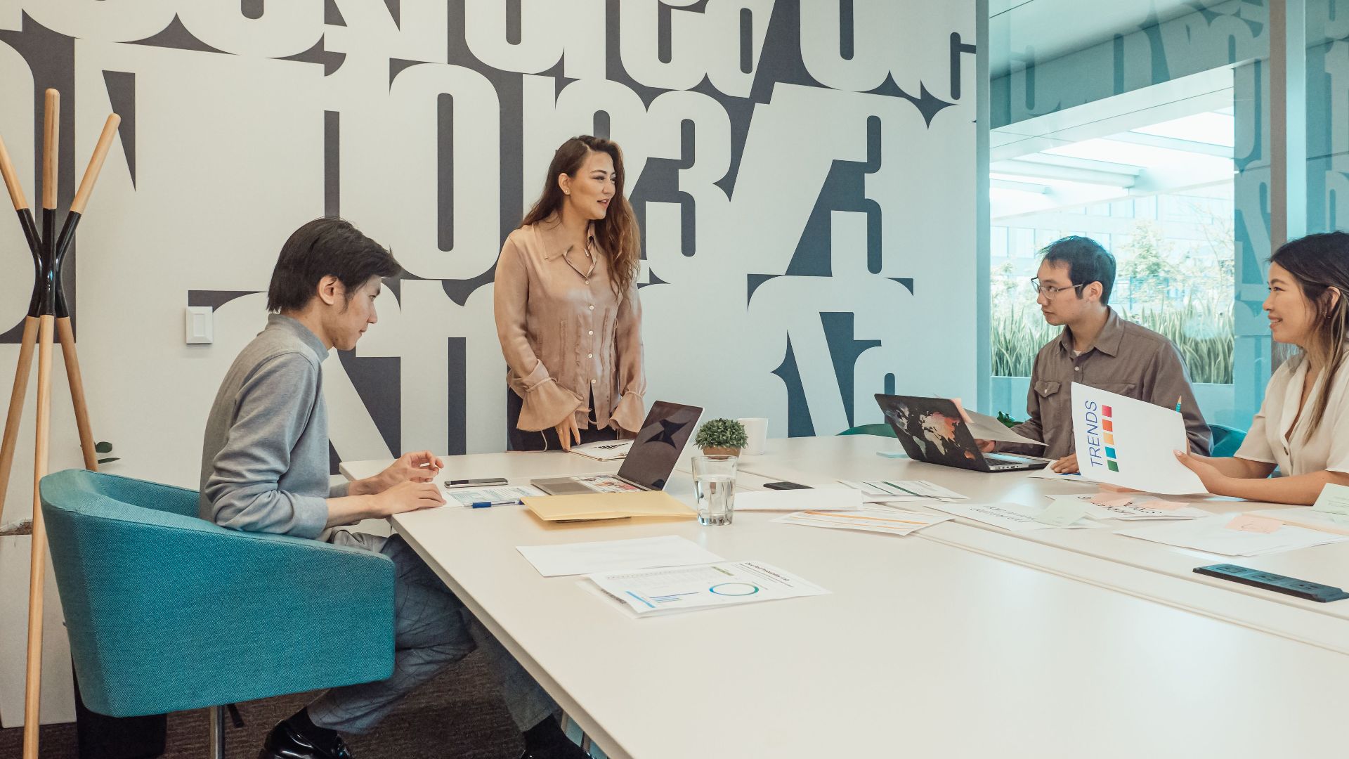 Diverse team engaged in brainstorming session in a modern office space.