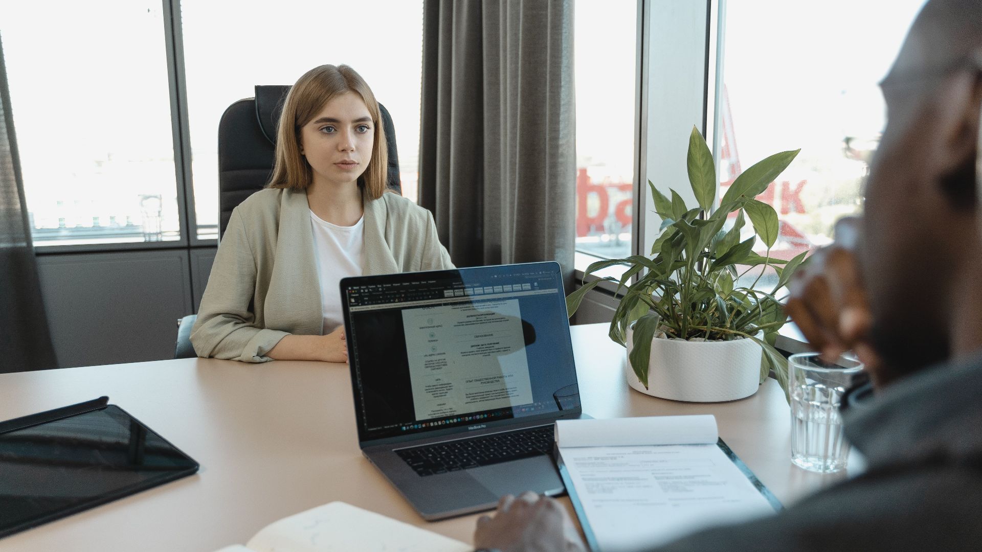 A professional job interview scene in a modern office setting, emphasizing recruitment and career opportunities.