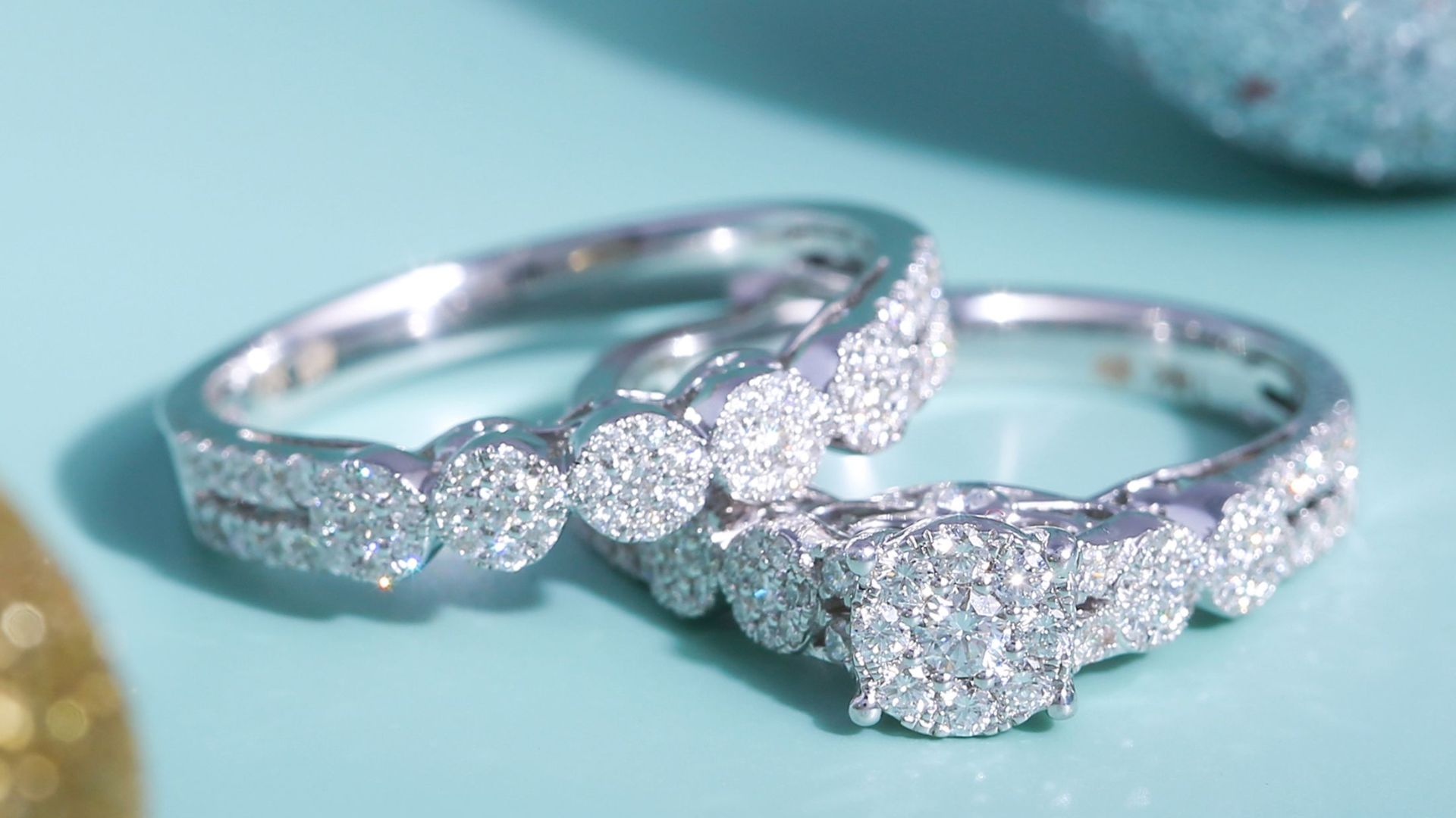 Close-up of luxurious diamond rings against a sparkling background, symbolizing elegance and affluence.