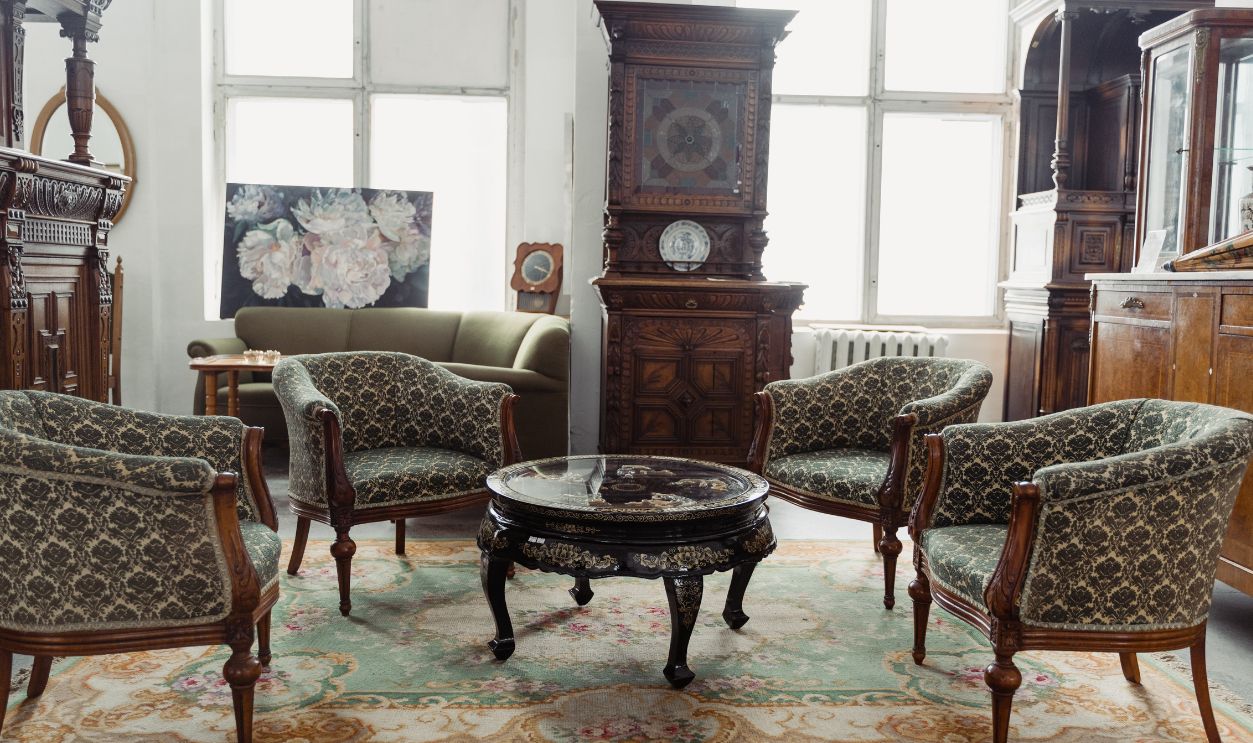 A charming vintage room featuring elegant antique furniture and decor.