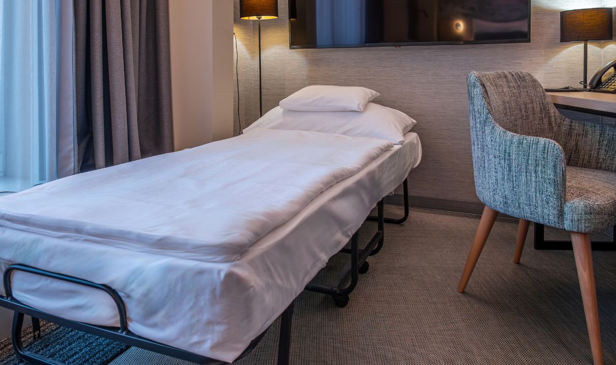 Hotel Room with Rollaway Bed and Modern Amenities
