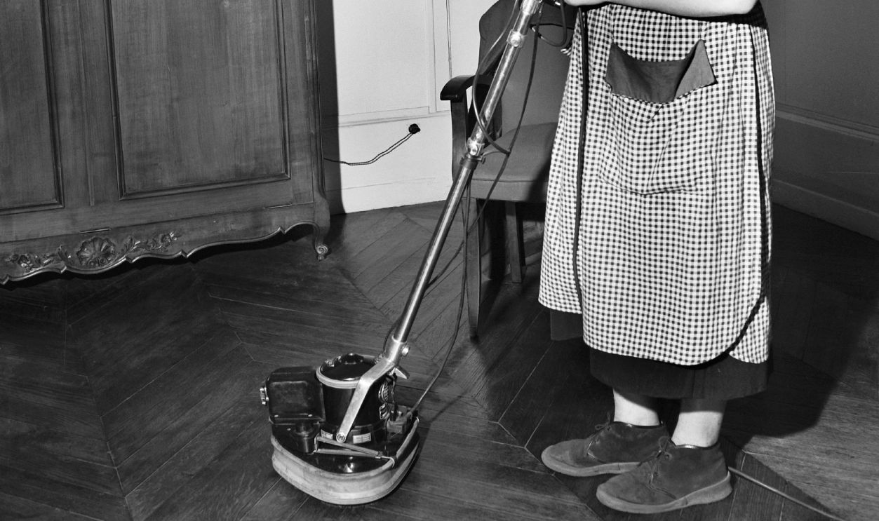 FRANCE - JANUARY 02: A Housewife Polishing The Wooden Floor In The Flat Around 1950