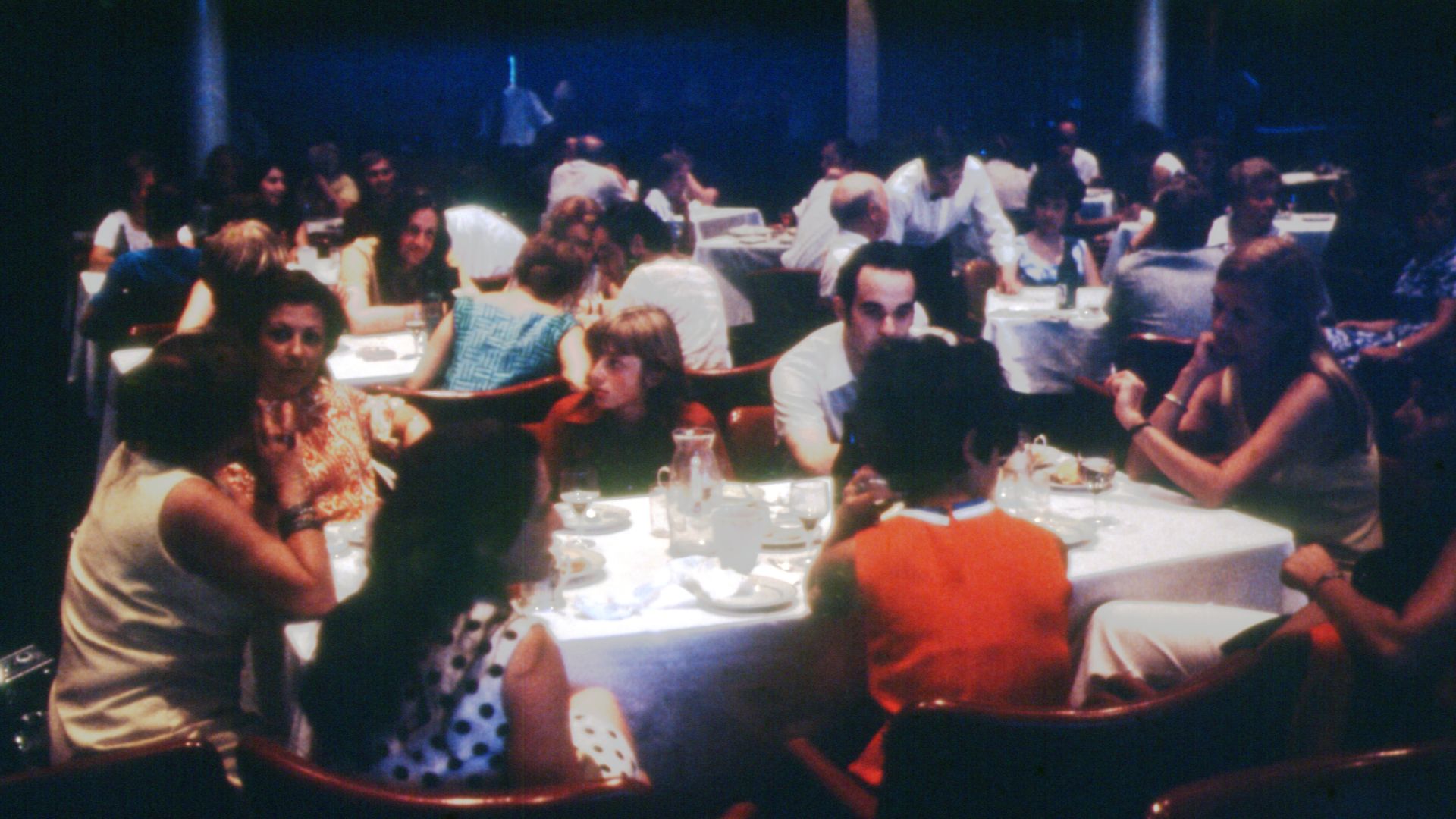The image is unidentified, but it features a scene of a restaurant. The photo was taken in 1975 in Leningrad, Russia.