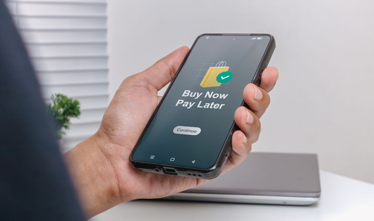 Shutterstock - 2737366123 - A man using smartphone for online shopping with payment later. Buy now pay later online shopping concept. BNPL.
