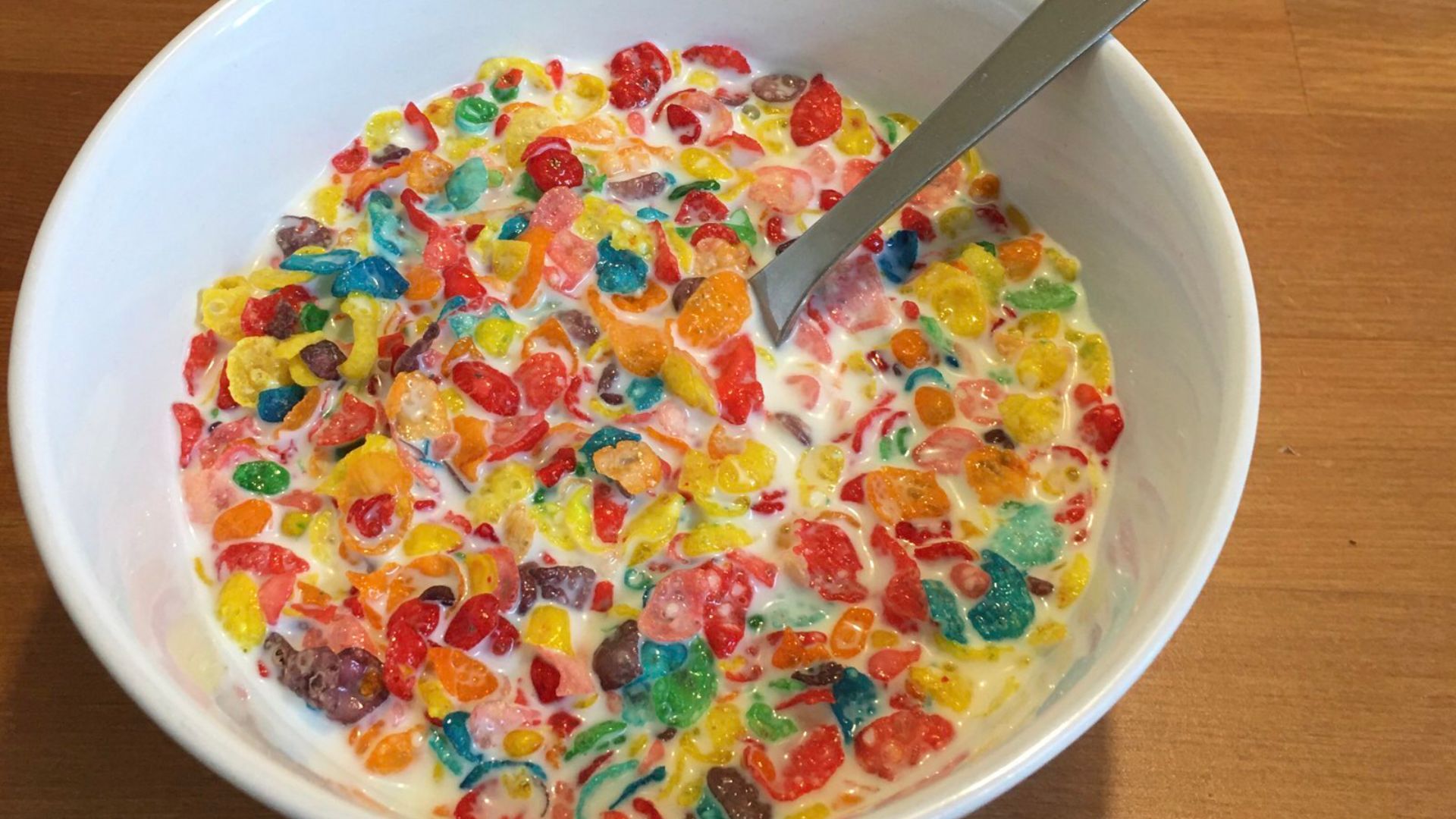 Fruity Pebbles cereal with milk (Sweetened Rice Cereal, Natural and Artificial Fruit Flavor)