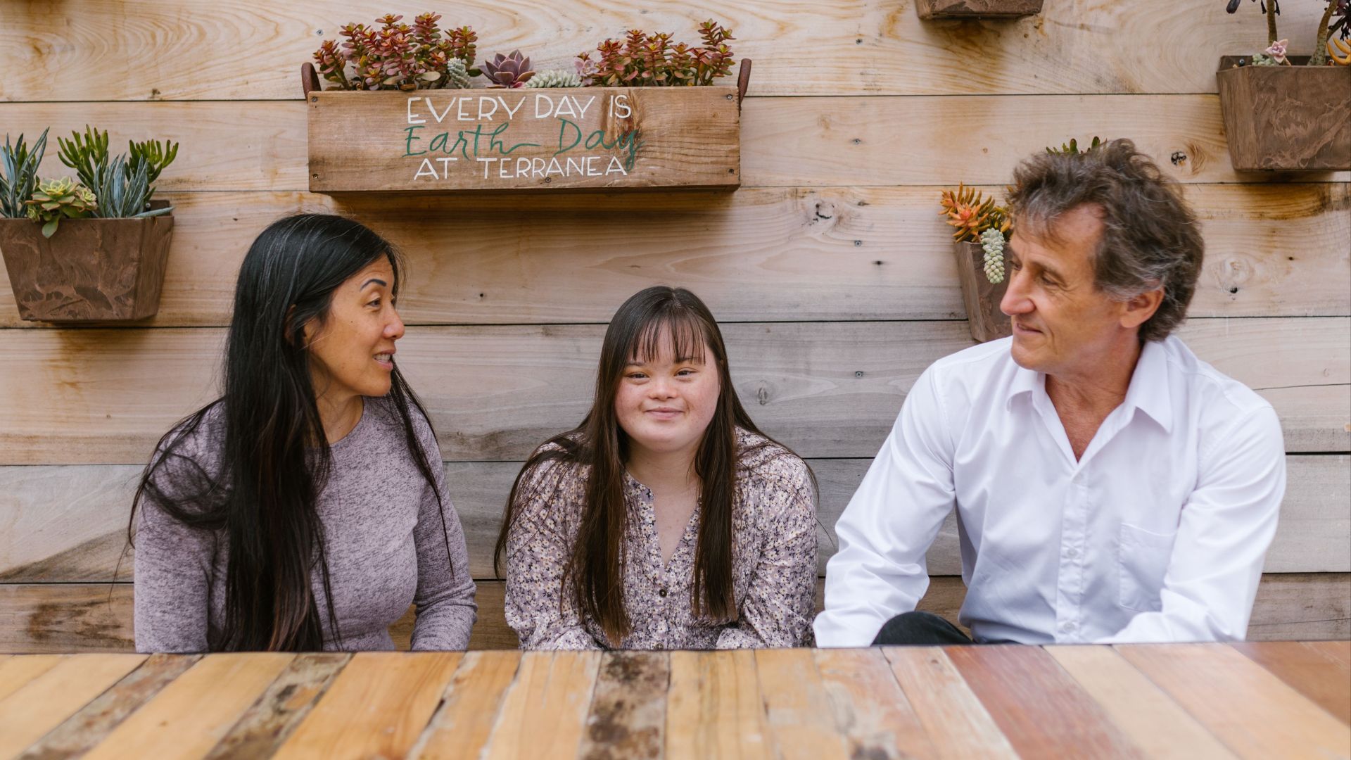 Family enjoying quality time together outdoors, fostering love and conversation.