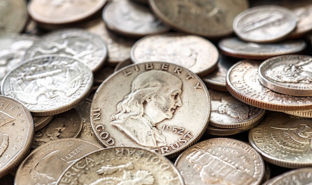 A pile of old American silver coins.