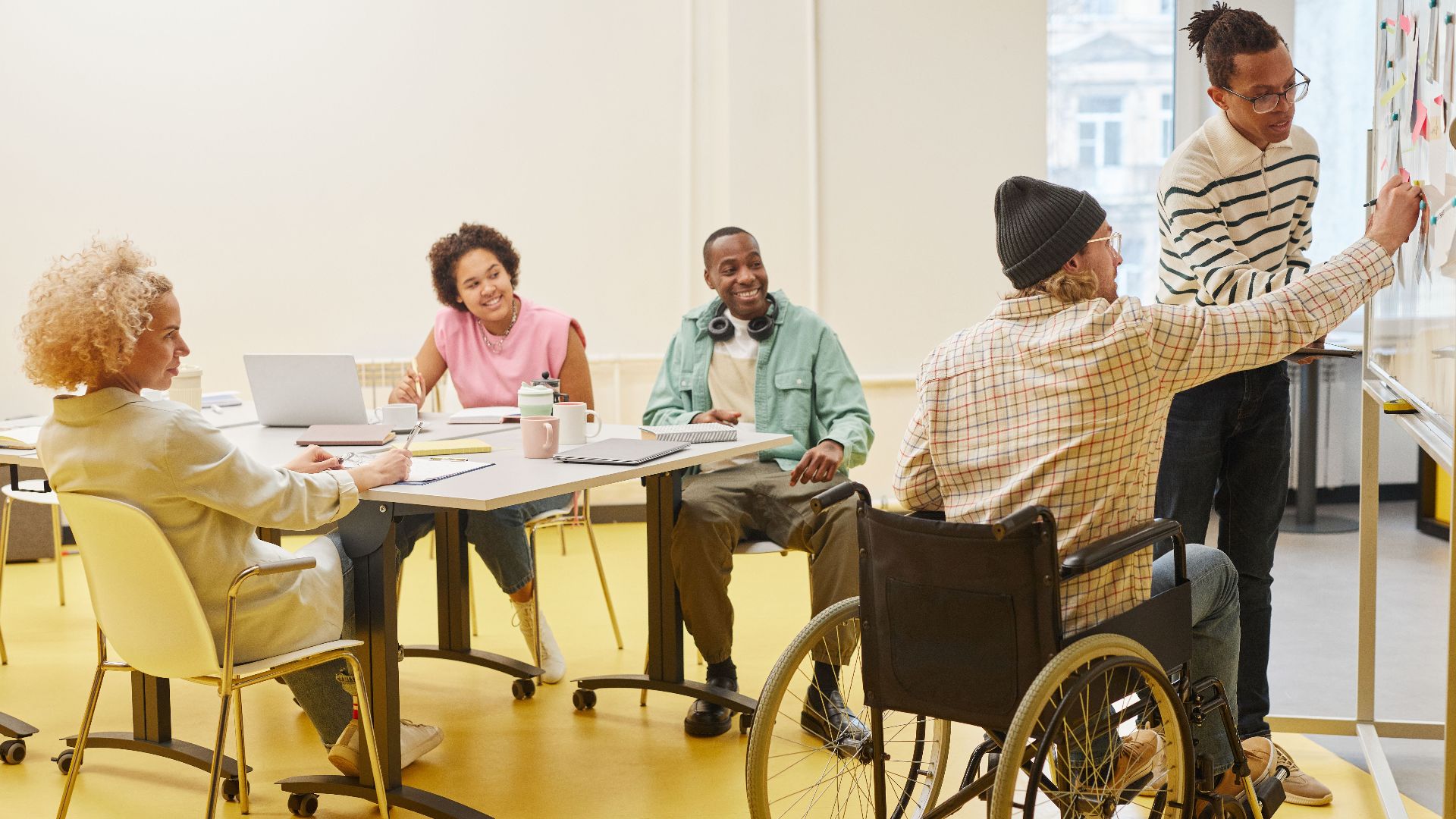 A diverse group of colleagues collaborating during a brainstorming session in a modern office setting.