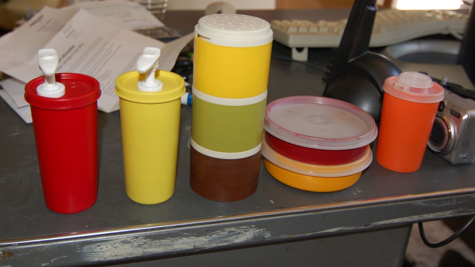 Tupperware containers, various colors