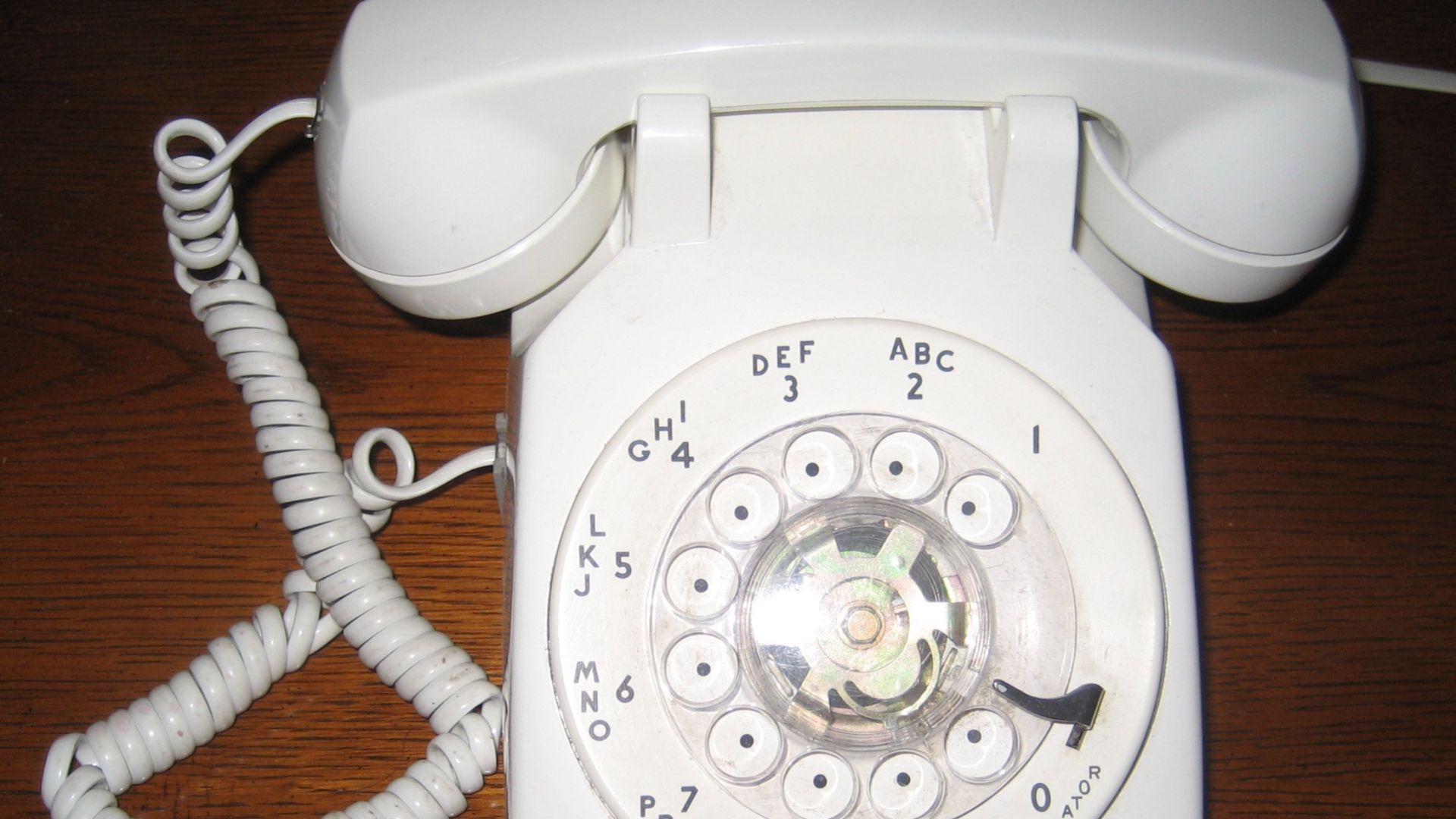 Standard USA table telephone, c. 1950s, with rotary dial (standard at the time before the pushbuttons came in c. late 1960s). Model made by Western Electric for Bell Telephone/ATT US domestic telephone monopoly.  These originally could not be sold; they w