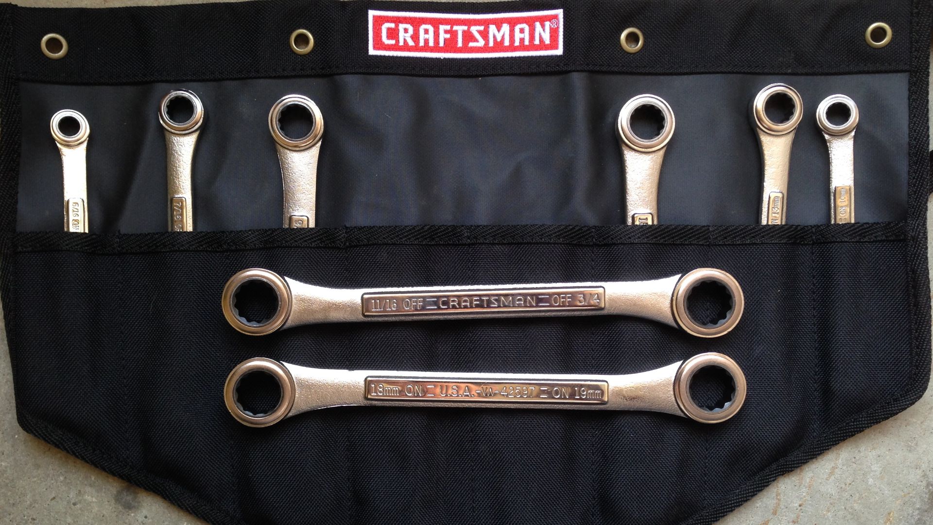A set of raised panel double box-end pawless ratcheting wrenches manufactured by Danaher Corporation for the Craftsman brand.