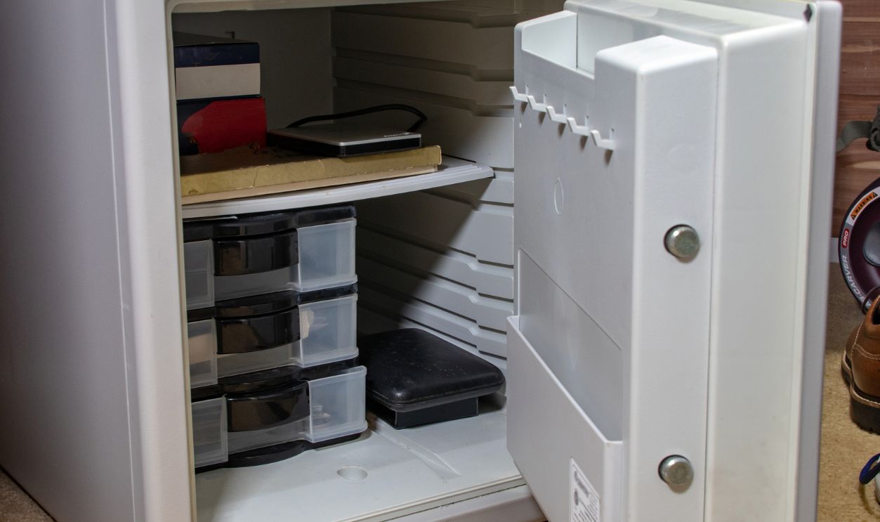 An Open Home Safe Storing a Variety of Valuables