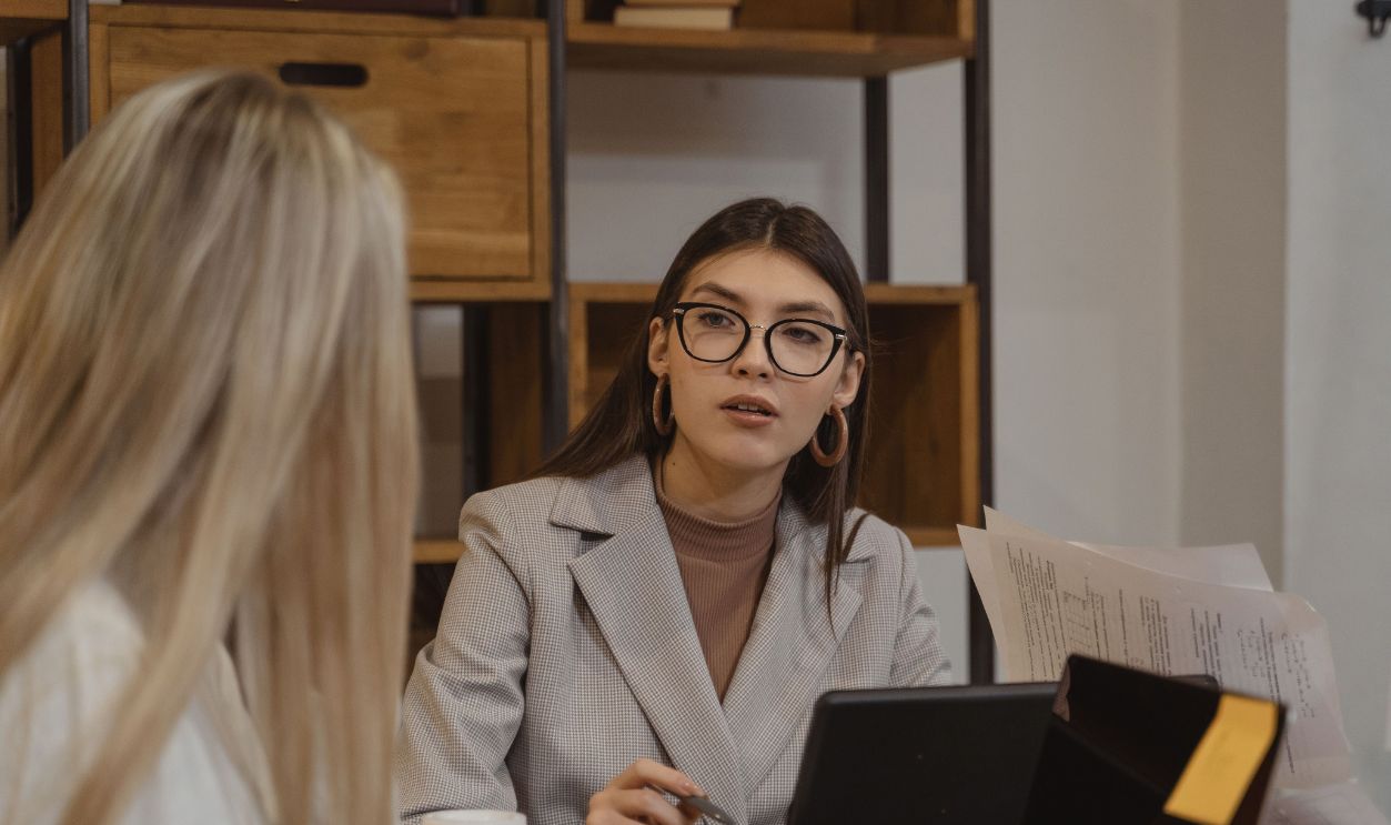 Three colleagues discussing business strategies at a meeting