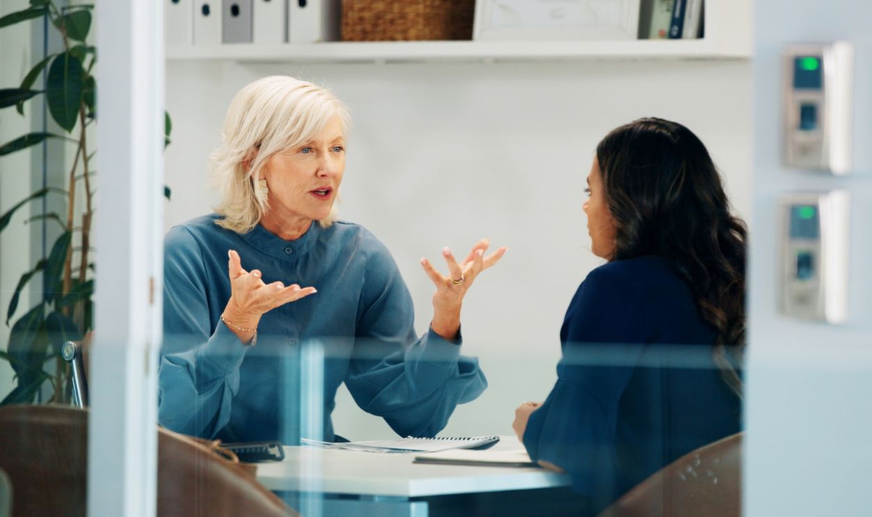 Serious, HR and meeting with employee, talking and discussion for poor performance and journalist. Error, women and explaining to worker, conversation and policy violations of company or disciplinary