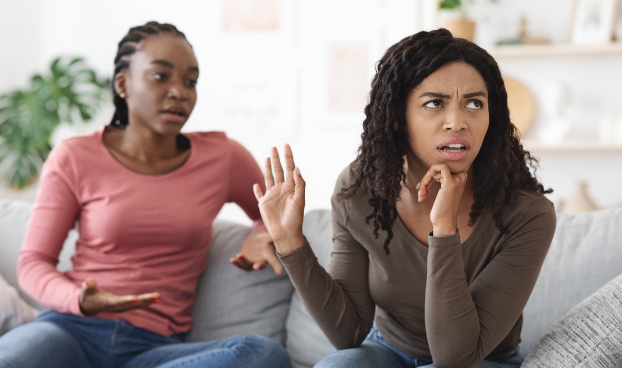 Two african american women girlfriends fighting at home